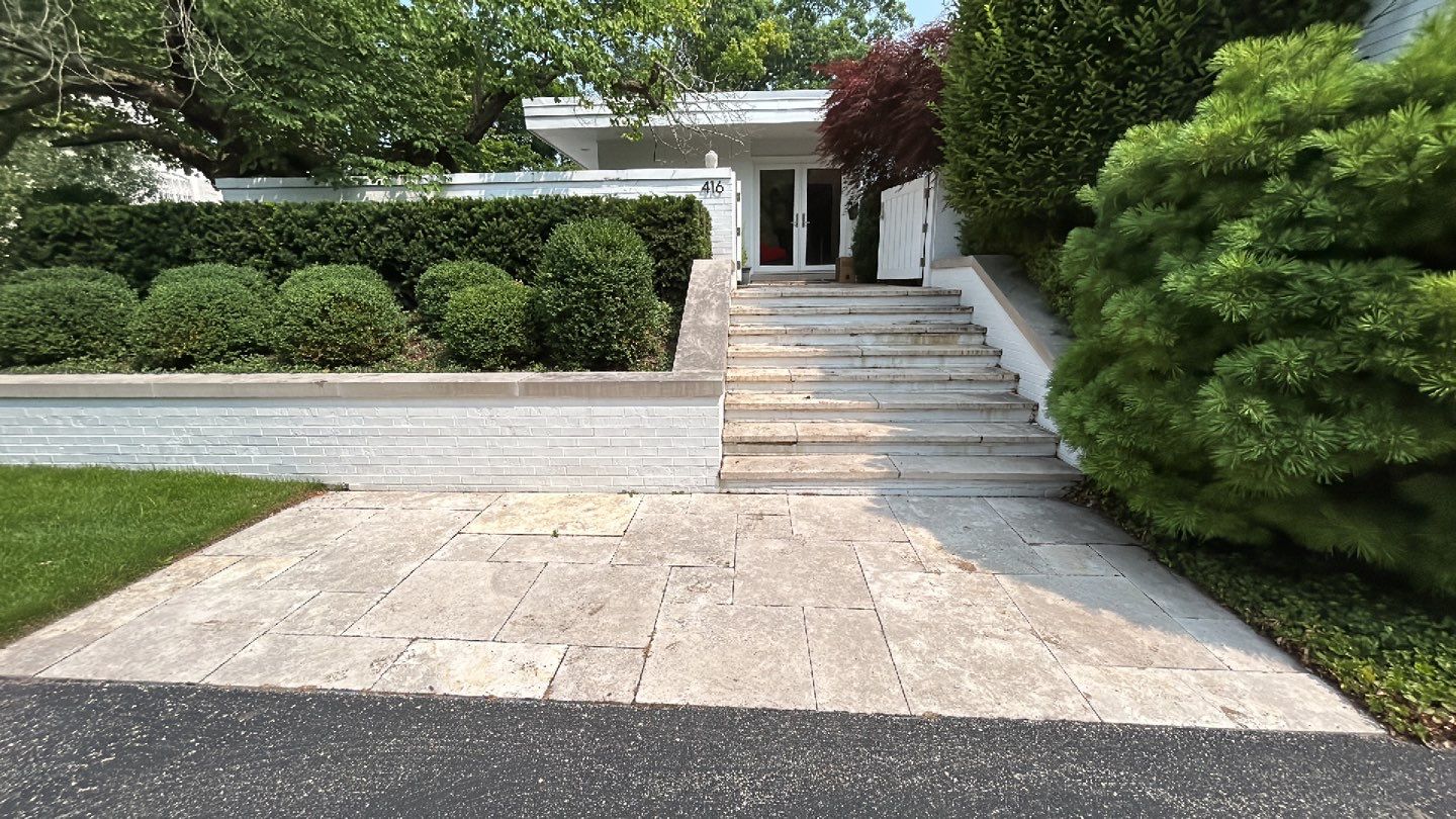 marble patio cleaning and sanding using Polysweep polymeric sand by Northern Power Washing LLC.