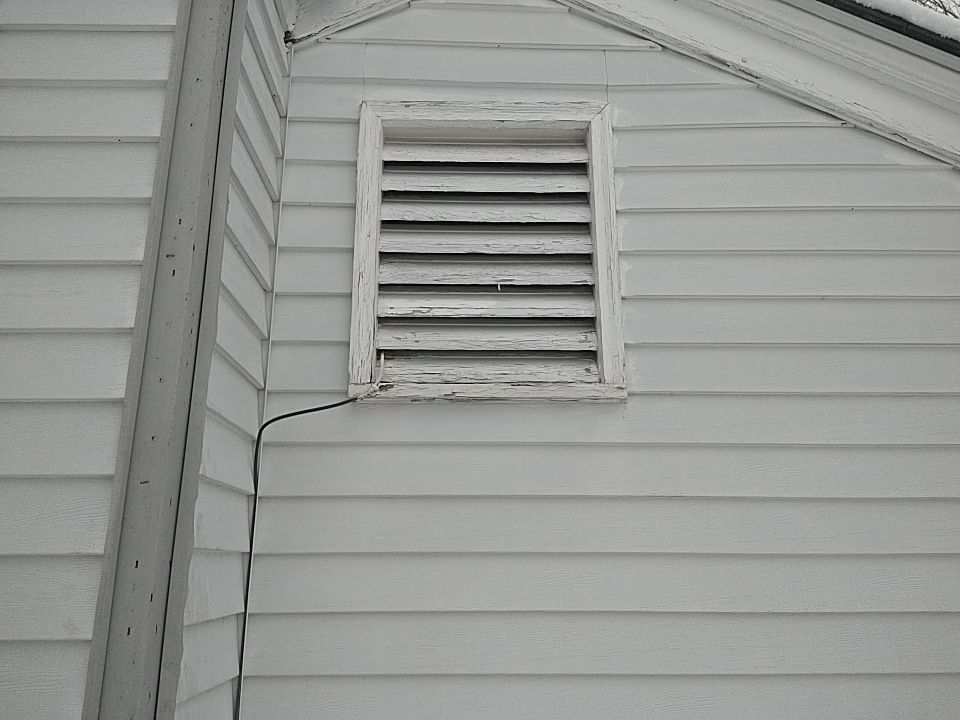 James Hardie Siding  using James Hardie Board and Batten, White by Absolute Roofing and Construction