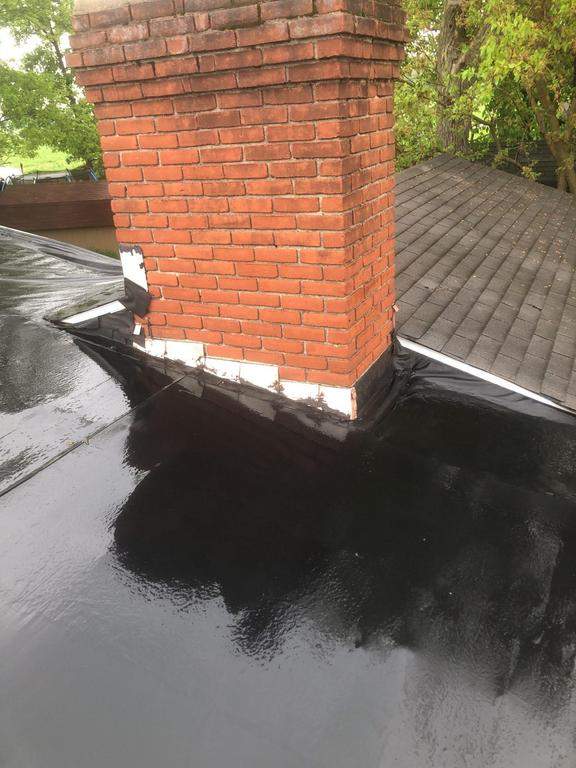 Residential Roofing Installation using 60 mil rubber roof  by Nitro Roofing and Construction