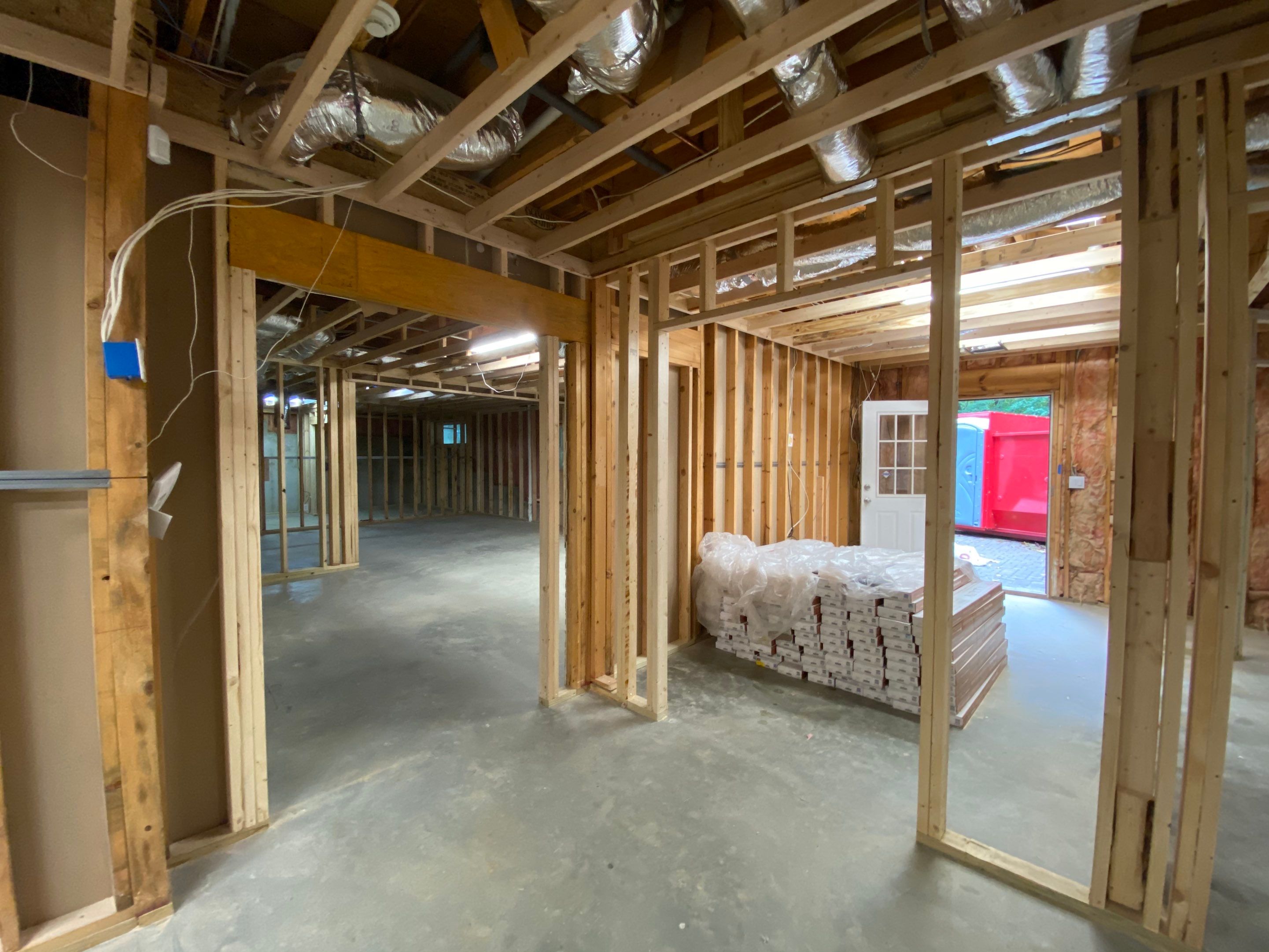 Acworth Basement Transformation With Wet Bar and Stone Fireplace by Swift Home Renovations