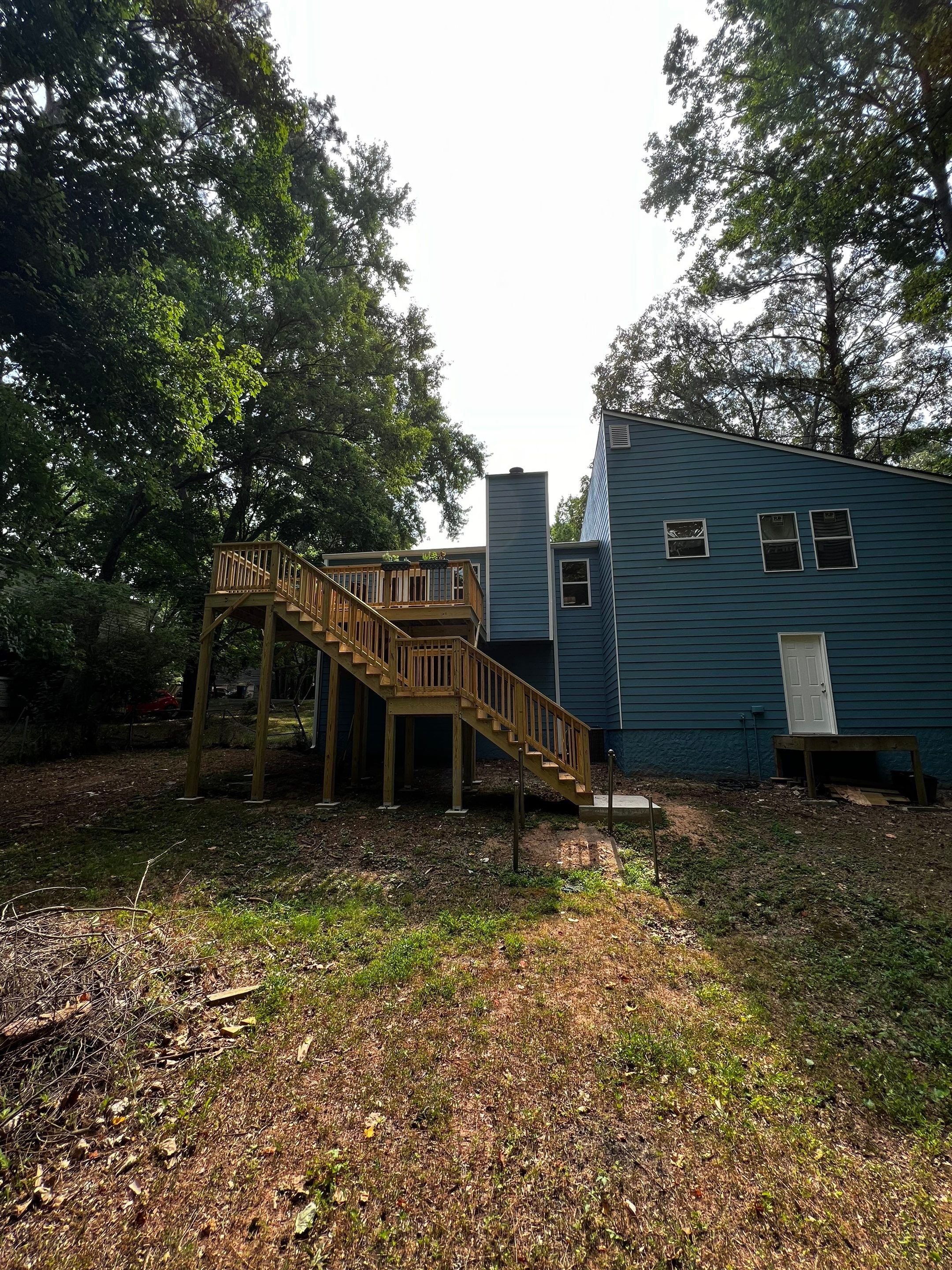 Elevated Wood Deck and Blue Lap Siding Installation in Kennesaw by Swift Home Renovations