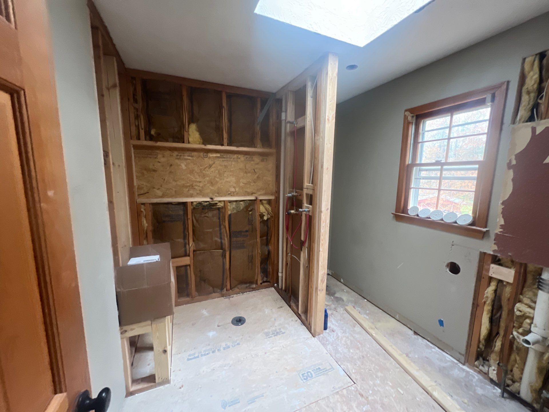 Modern Bathroom Remodeling Featuring Marble Tiles and Custom Cabinetry in Smyrna by Swift Home Renovations