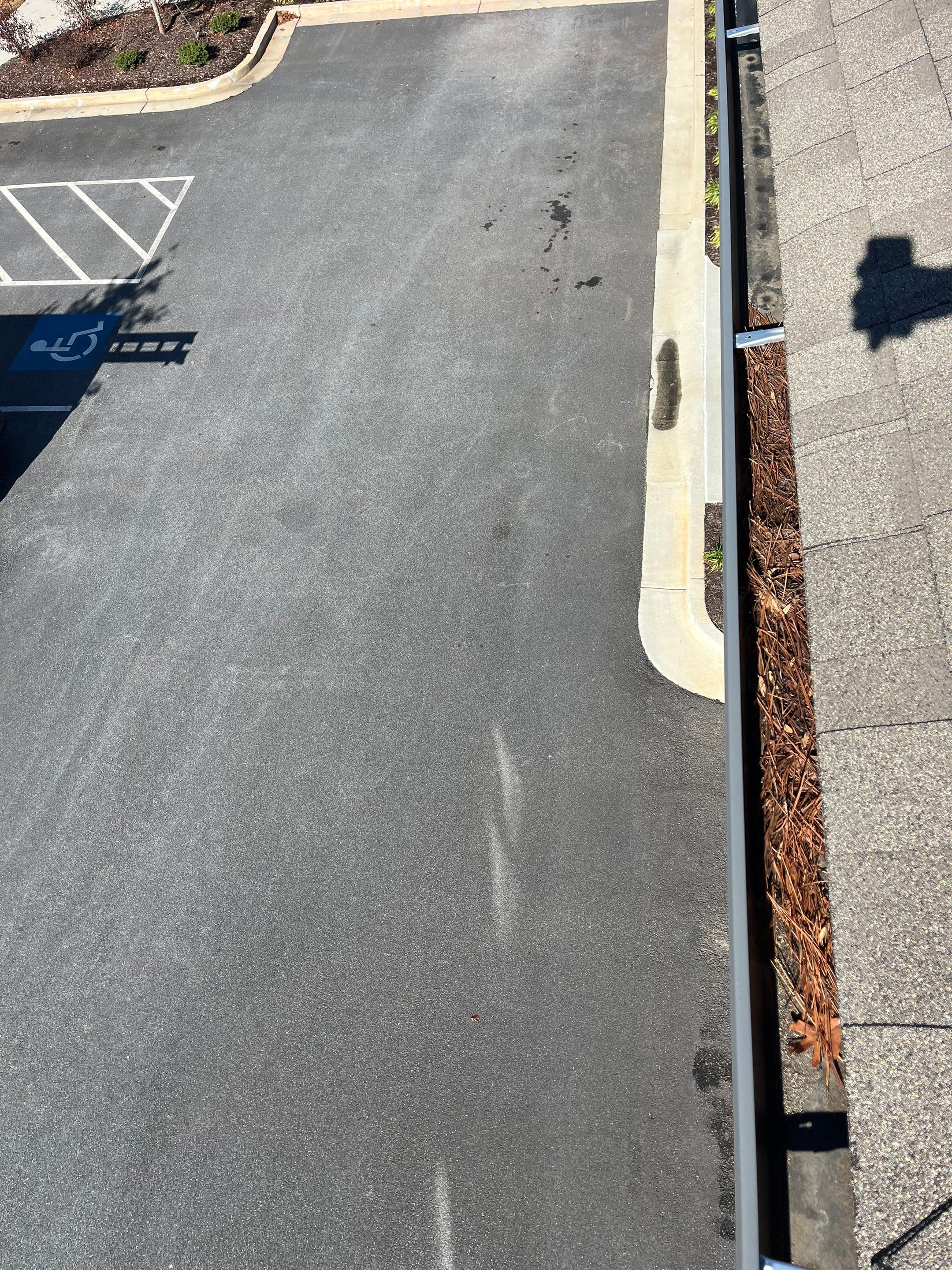 HOA gutter cleaning in Woodstock & Canton, GA,before  photo showing full gutters.