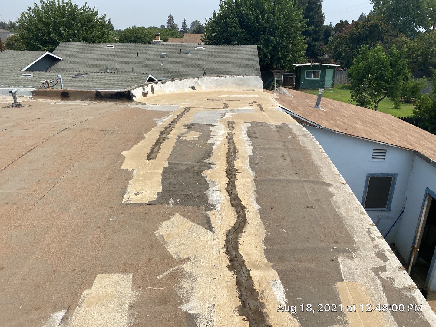 Residential Roofing Installation using Spray foam roofing insulation and General Coatings acrylic coatings by Straight Edge Roofing Inc