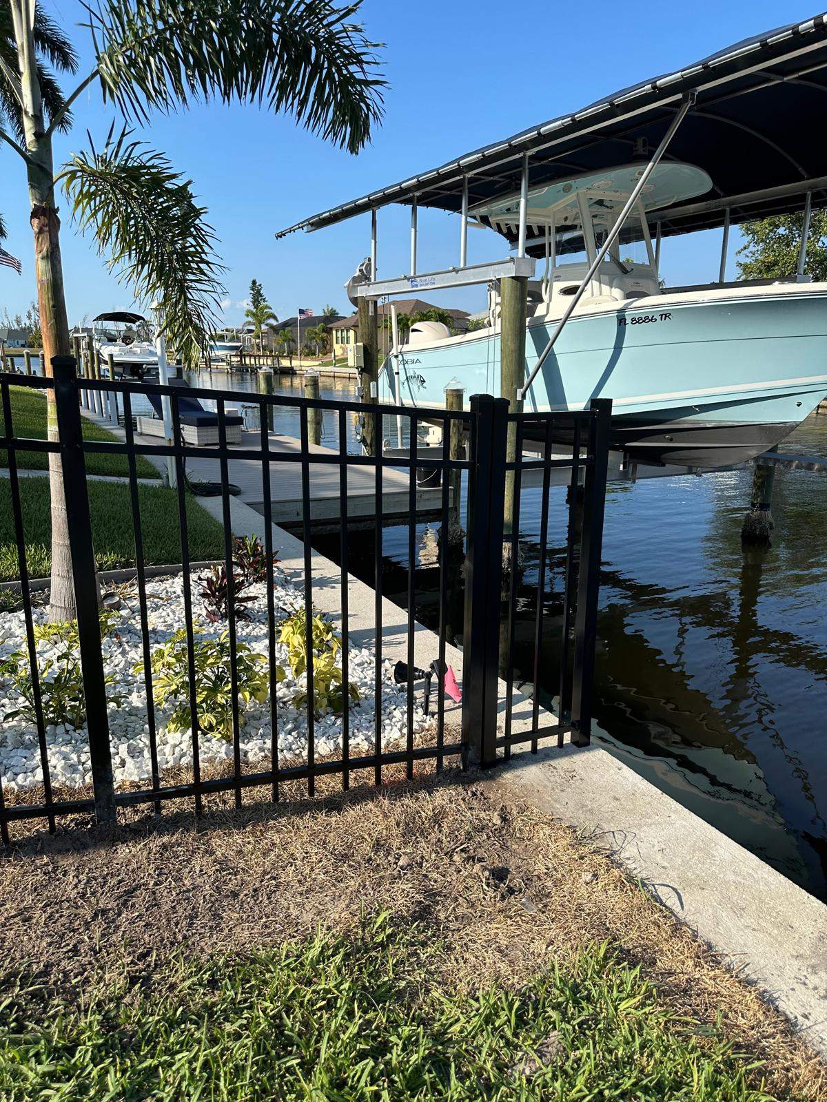 Waterfront Black Aluminum Fence Installation in Port Charlotte by True Fence LLC