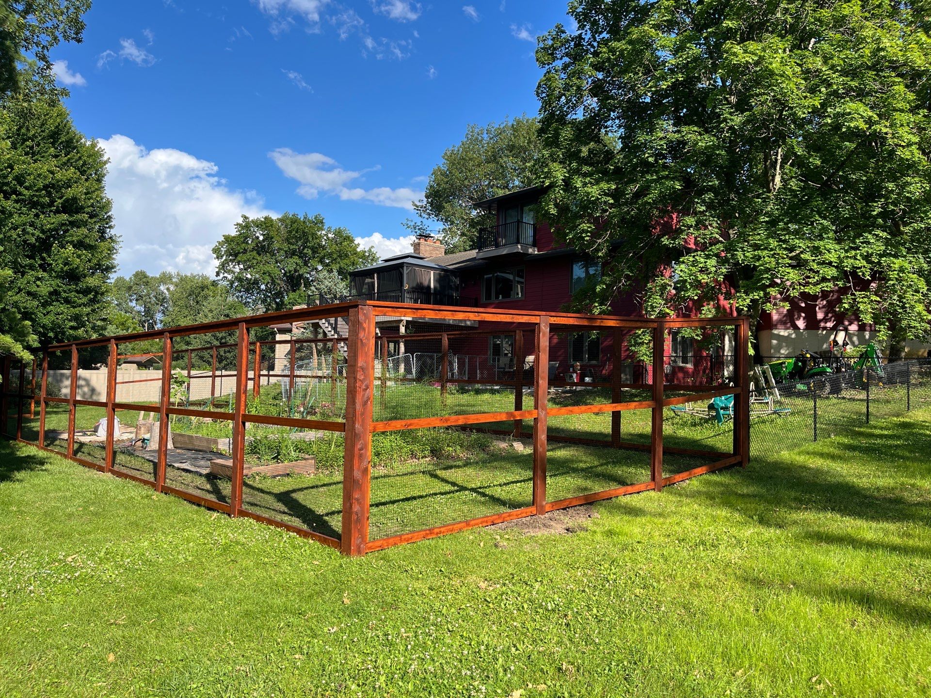 Stained Cedar Mahogany Garden Fence and Raised Bed Enclosure in Cedar Falls by Perfect Picket Fence and Stain
