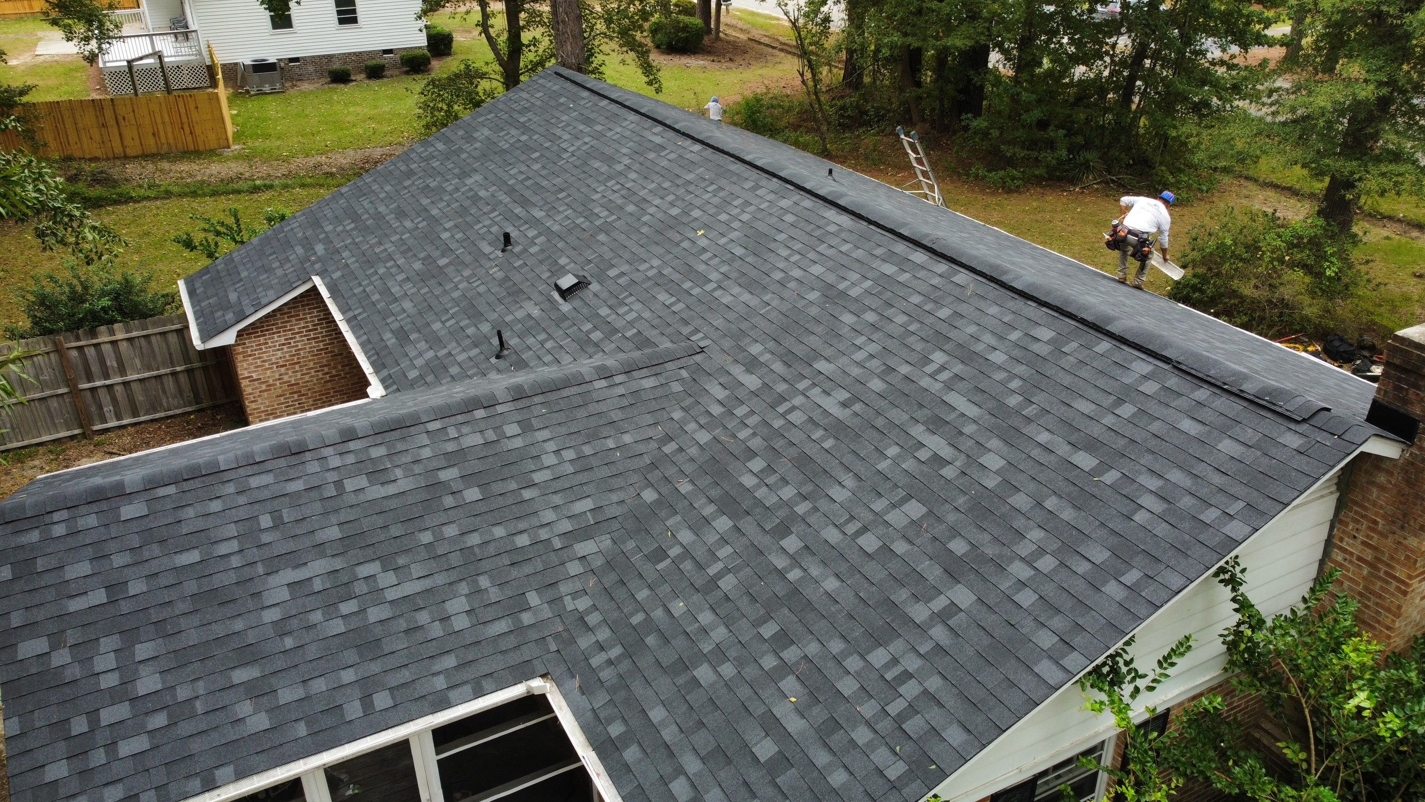 New Onyx Black Shingle Roof Replacement and Tree Damage Repair. by Midlands Roofing & Exteriors