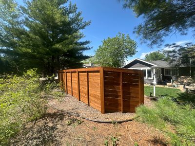 Horizontal Stained Wood Privacy Fence Installation in Waterloo