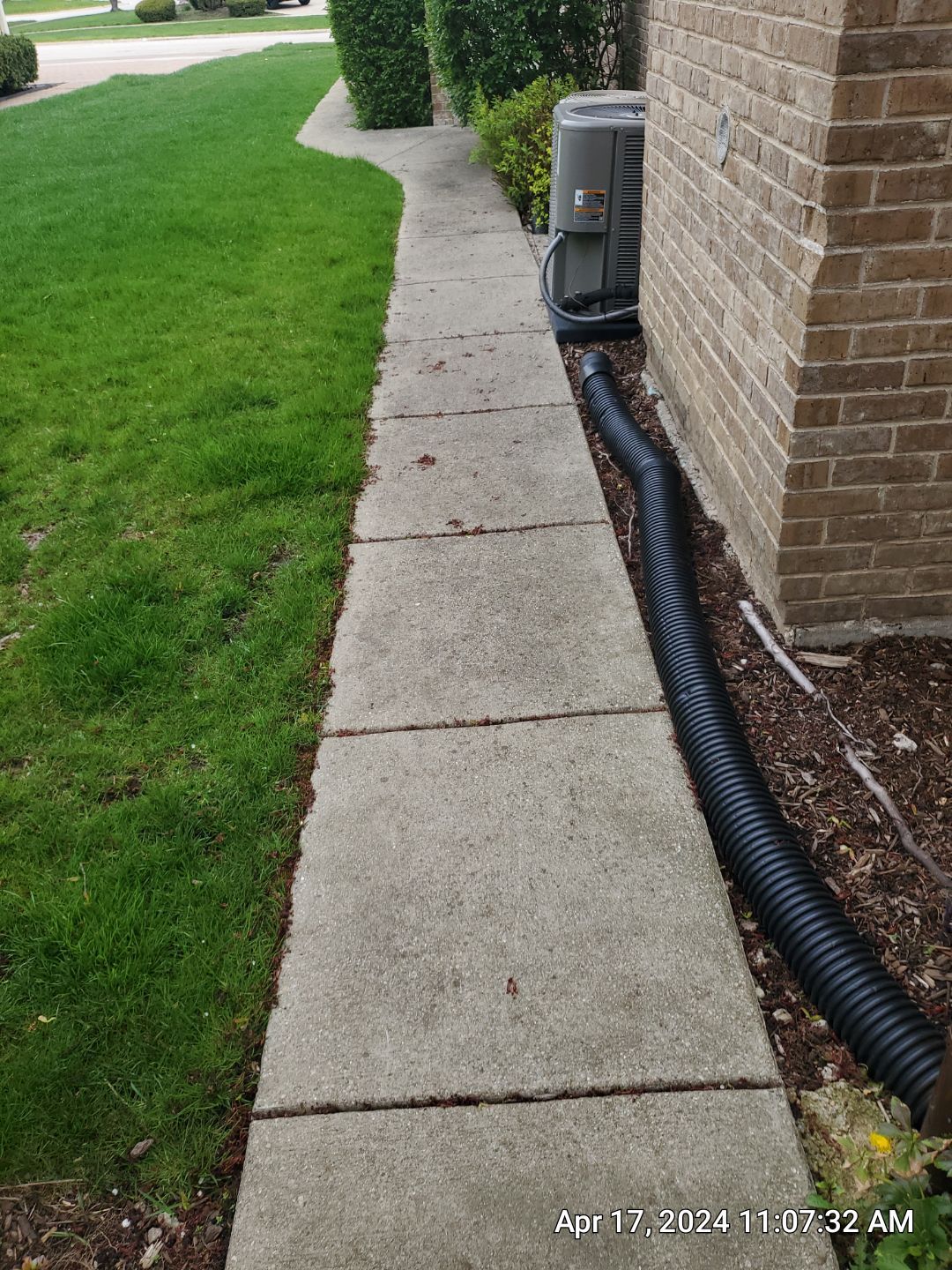 concrete patio and driveway cleaning by Northern Power Washing LLC.