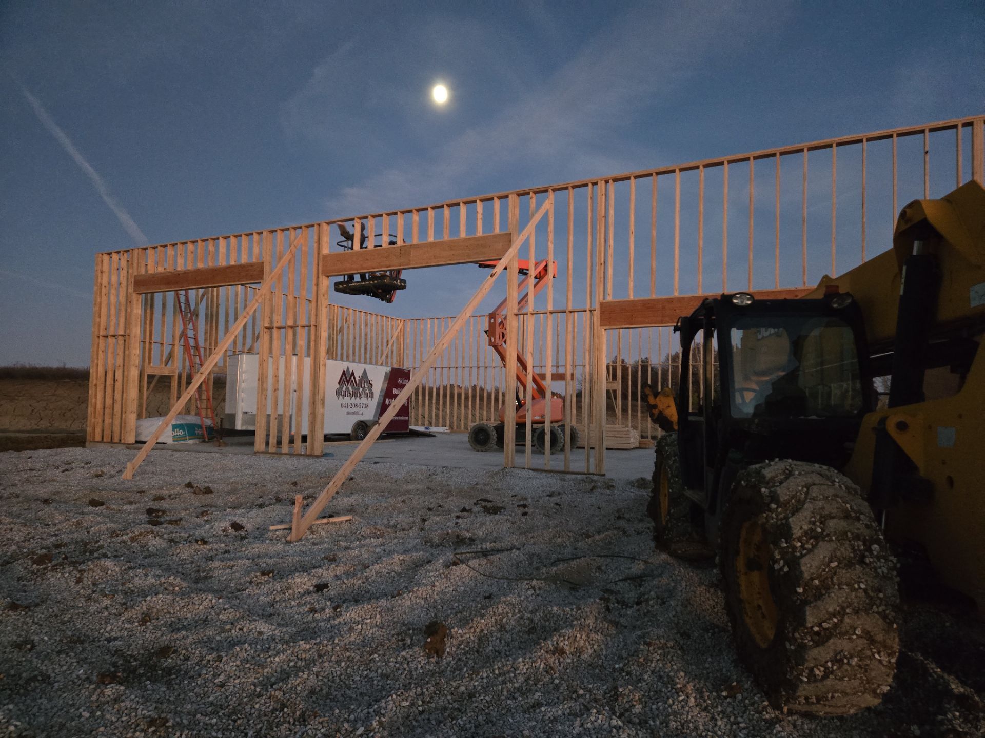 New Home construction w/ board and batten sides and metal roof  by Miles Construction 