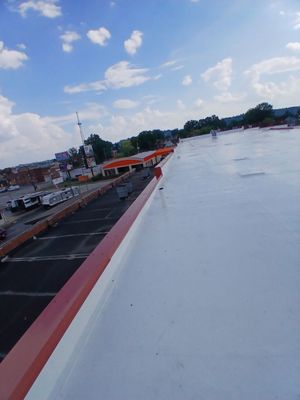 Commercial Roofing Installation using smartcoat Roof coating