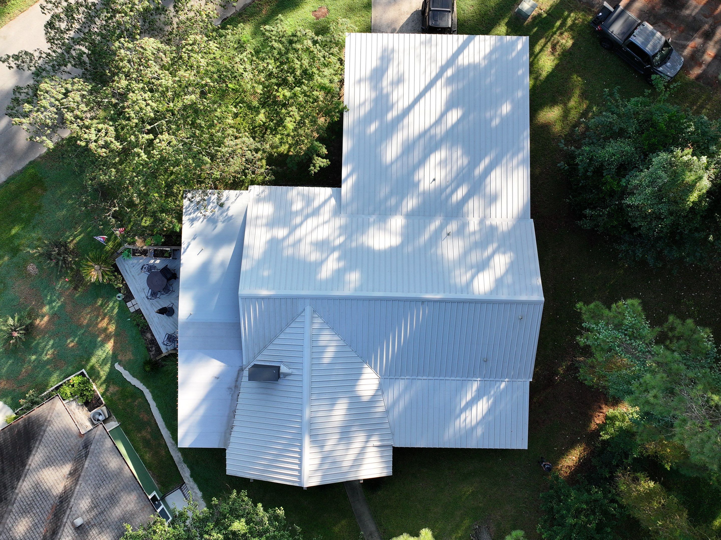 White Standing Seam Metal Roof Replacement in Willis, Texas by Abbott Roofing Company