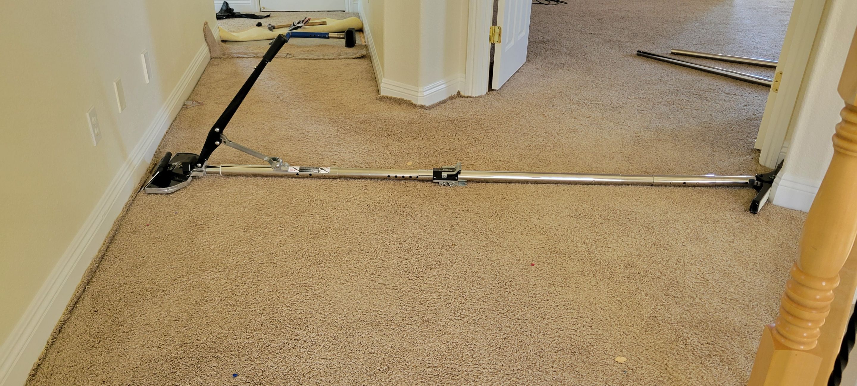 Stretching Hallway Carpet of a Rental by Ardent Carpet Restore LLC