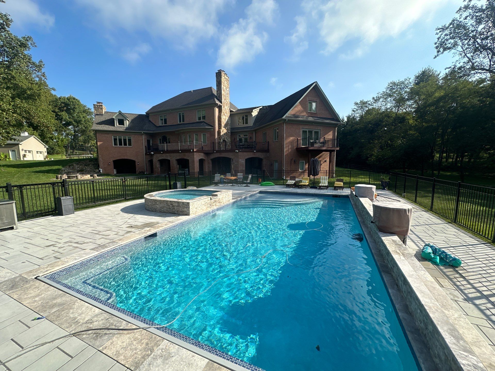 Gunite Pool w/ Spa and Water Features  by Elysium Pools