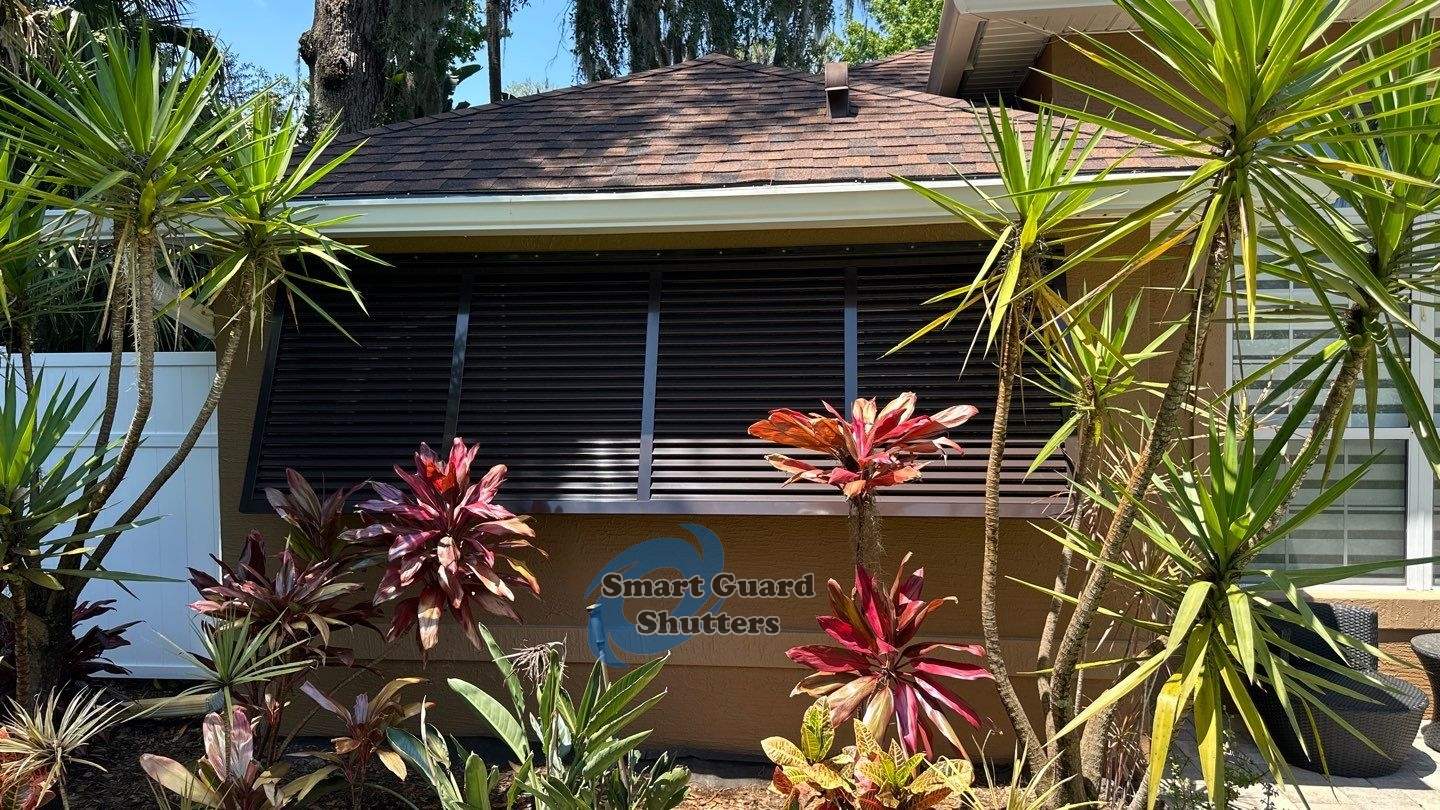 Decorative Bahama Shutter in Grey Brown by Smart Guard Shutters