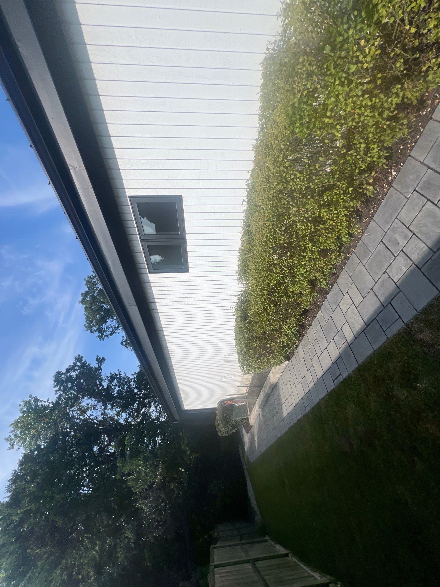 Complete Exterior House, Bluestone & Garage Floor Cleaning by Northern Power Washing LLC.