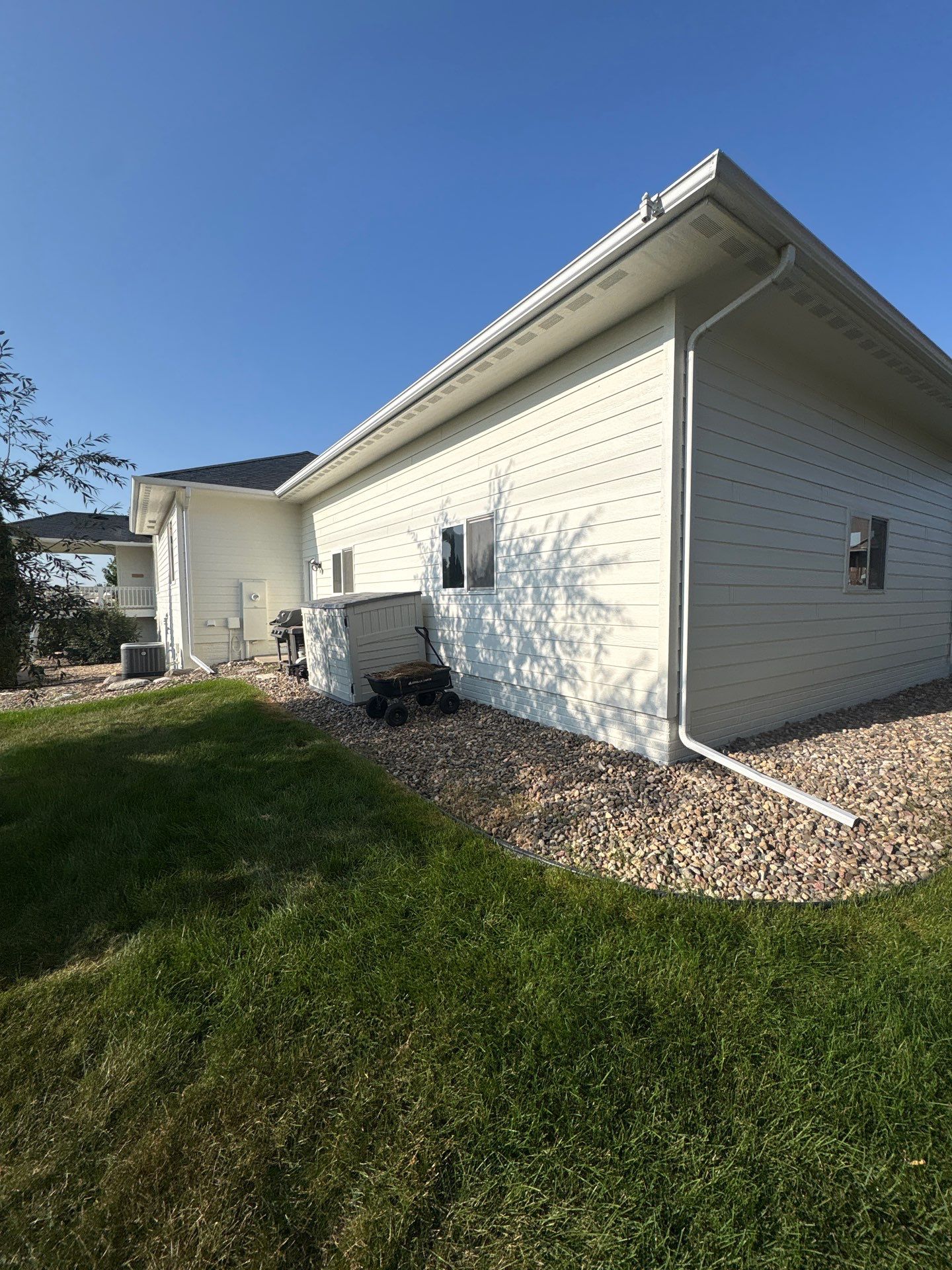Sioux Falls Exterior Residential Siding and Deck Painting Project by Select Painting, Coatings & Garage Cabinets