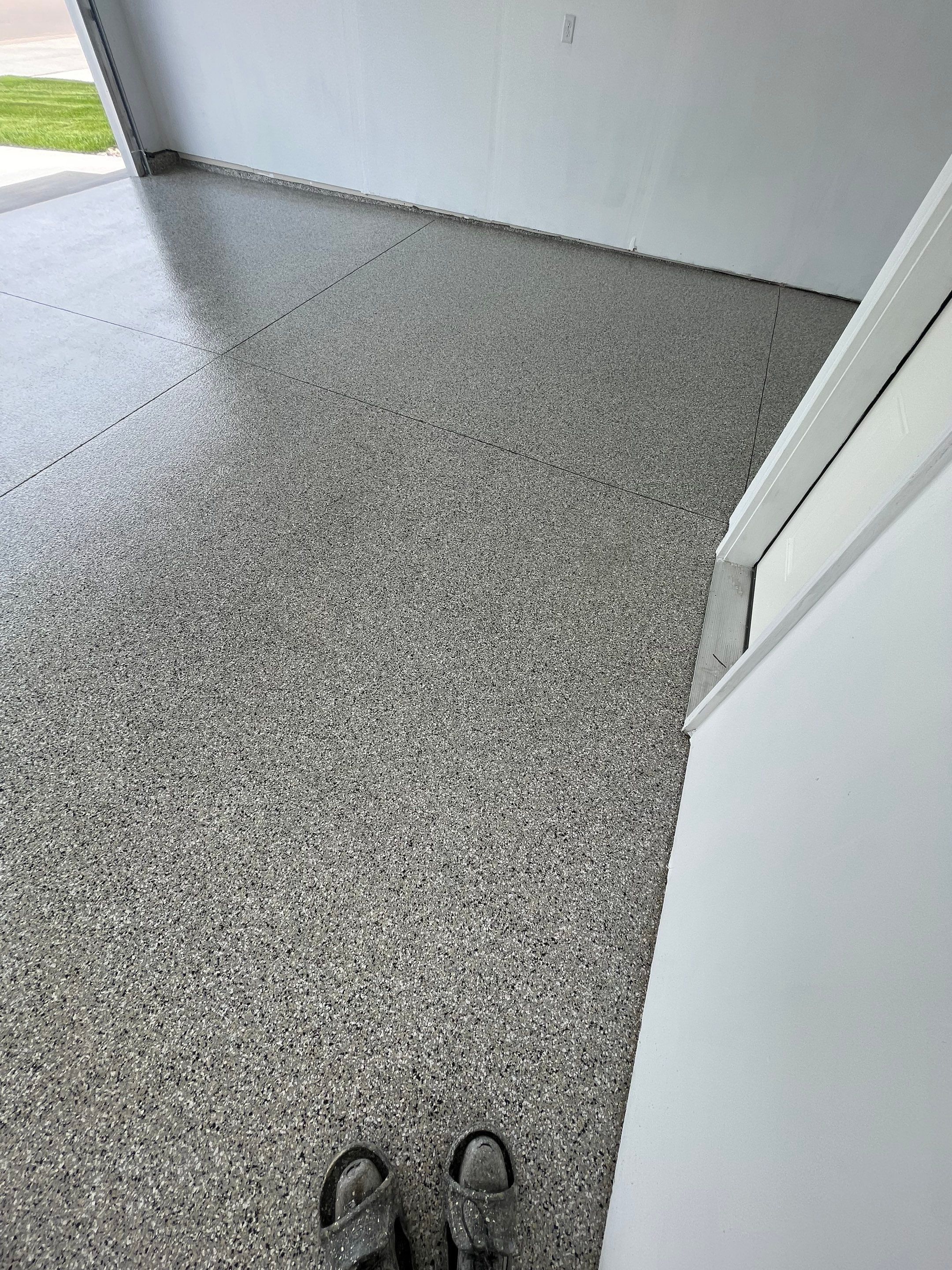 Sioux Falls Garage Floor Transformation with Cabin Fever Decorative Chips by Select Painting, Coatings & Garage Cabinets