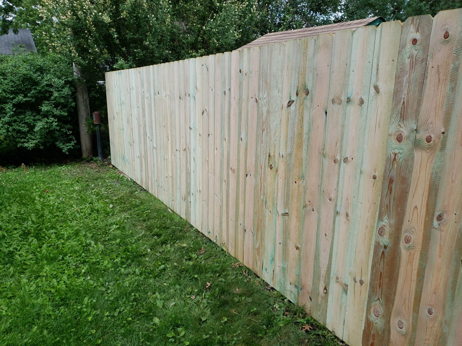 Custom Wood Privacy Fence Installation for Charles City Backyard by Perfect Picket Fence and Stain