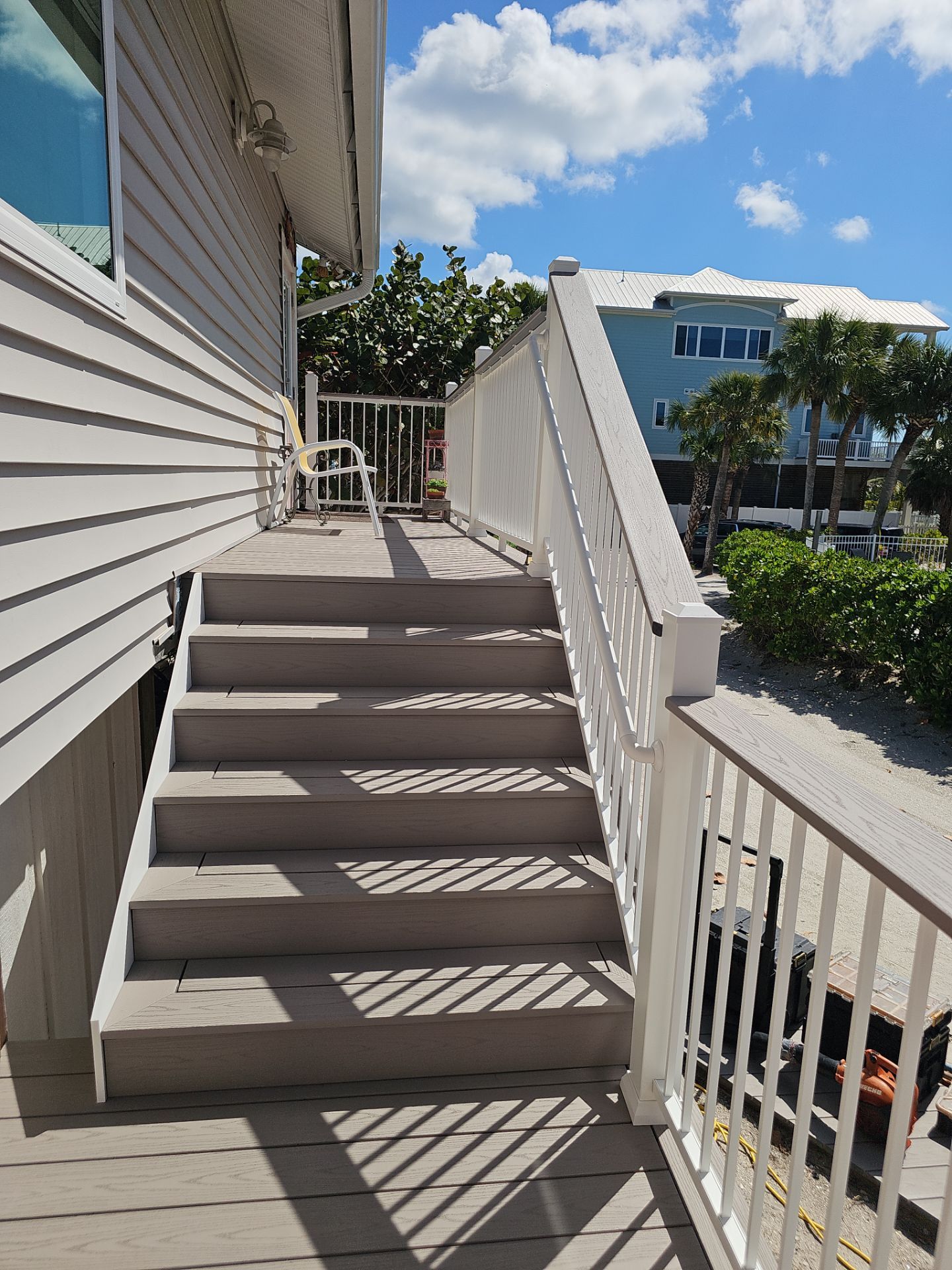 Elevated Composite Deck and Symmetrical Staircase Replacement in Englewood by Smirnov Construction Inc