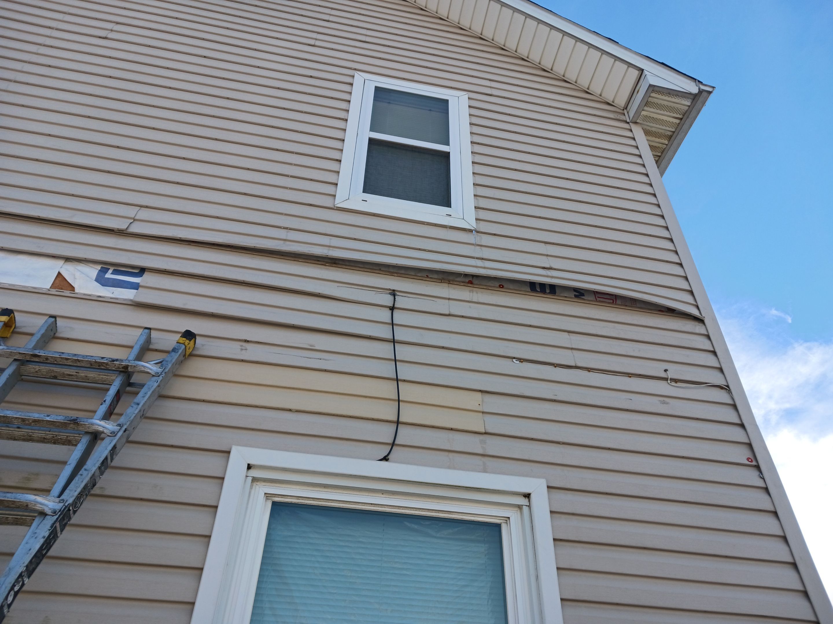 Wind damage to Siding: Insurance paid for full replacement of all siding by Absolute Roofing and Construction