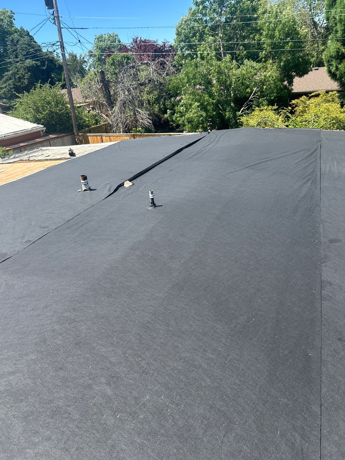 Residential Flat Roof Installation using GAF 60Mil TPO  by Orezona Building & Roofing Company, Inc.