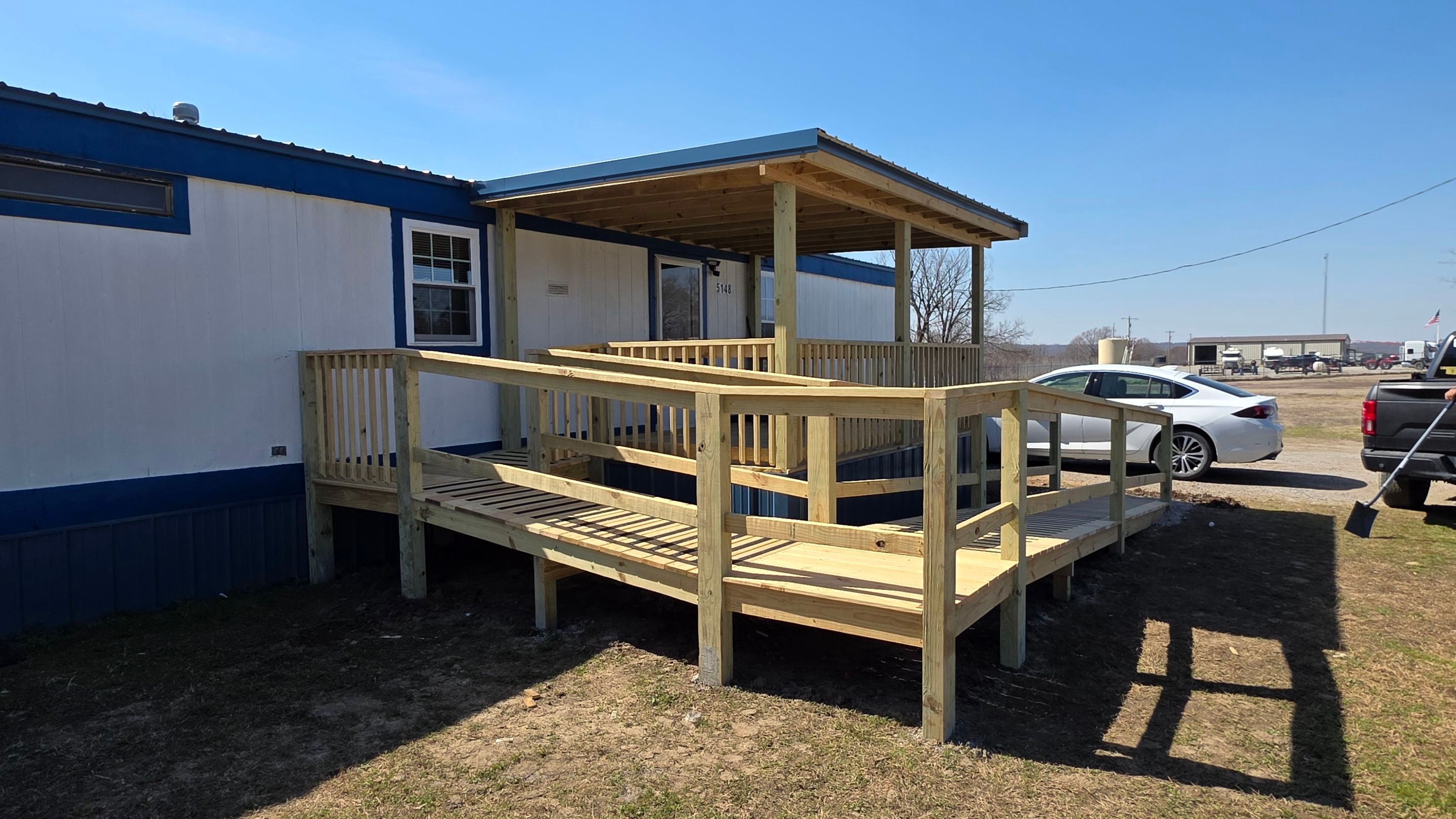 Covered Deck w/ ADA Ramp by In & Out Construction & Remodeling, LLC