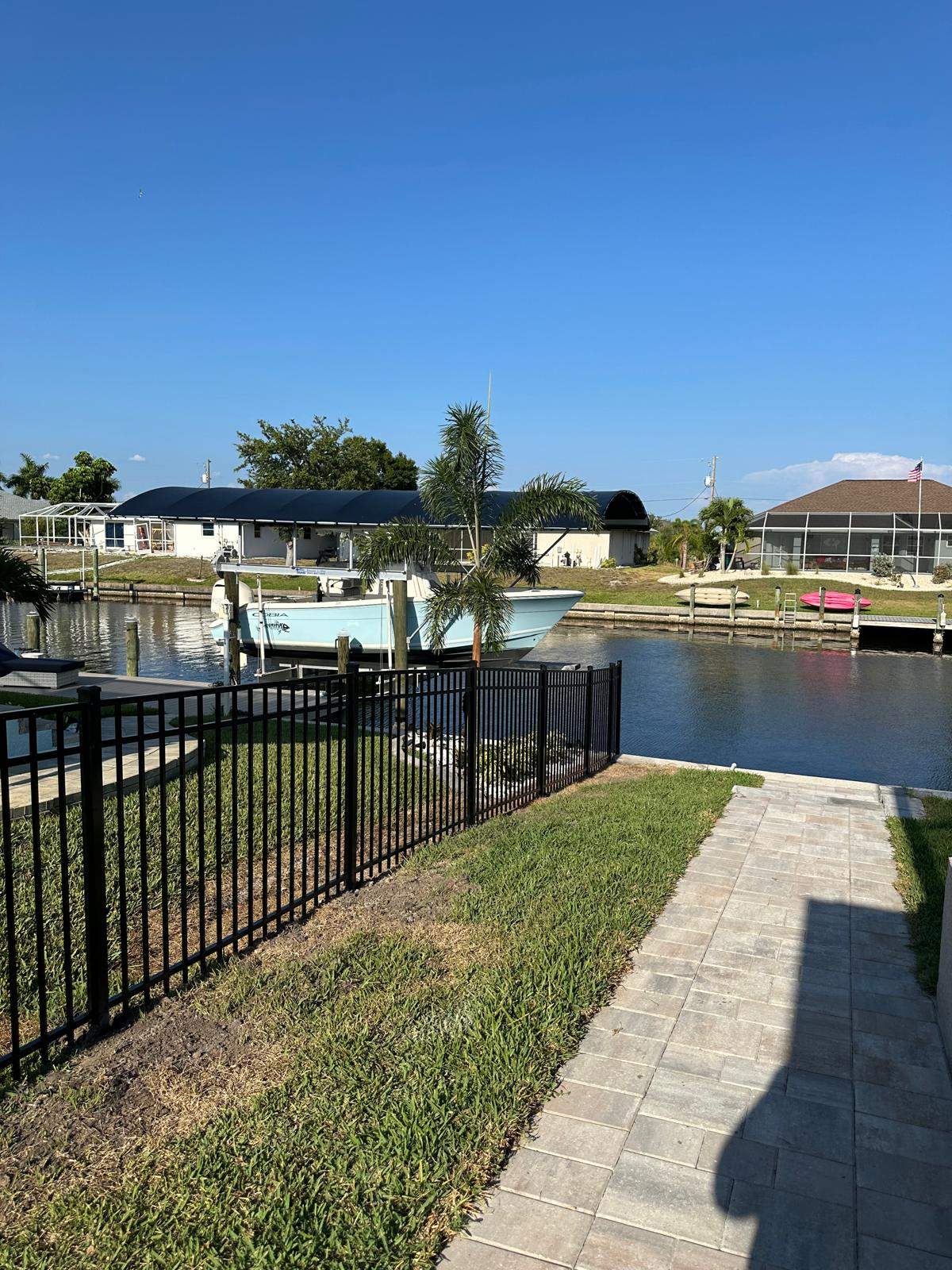 Waterfront Black Aluminum Fence Installation in Port Charlotte by True Fence LLC