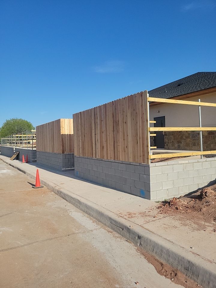 Cedar Fence using Cedar Pickets and Metal Poles by Clays Services Inc