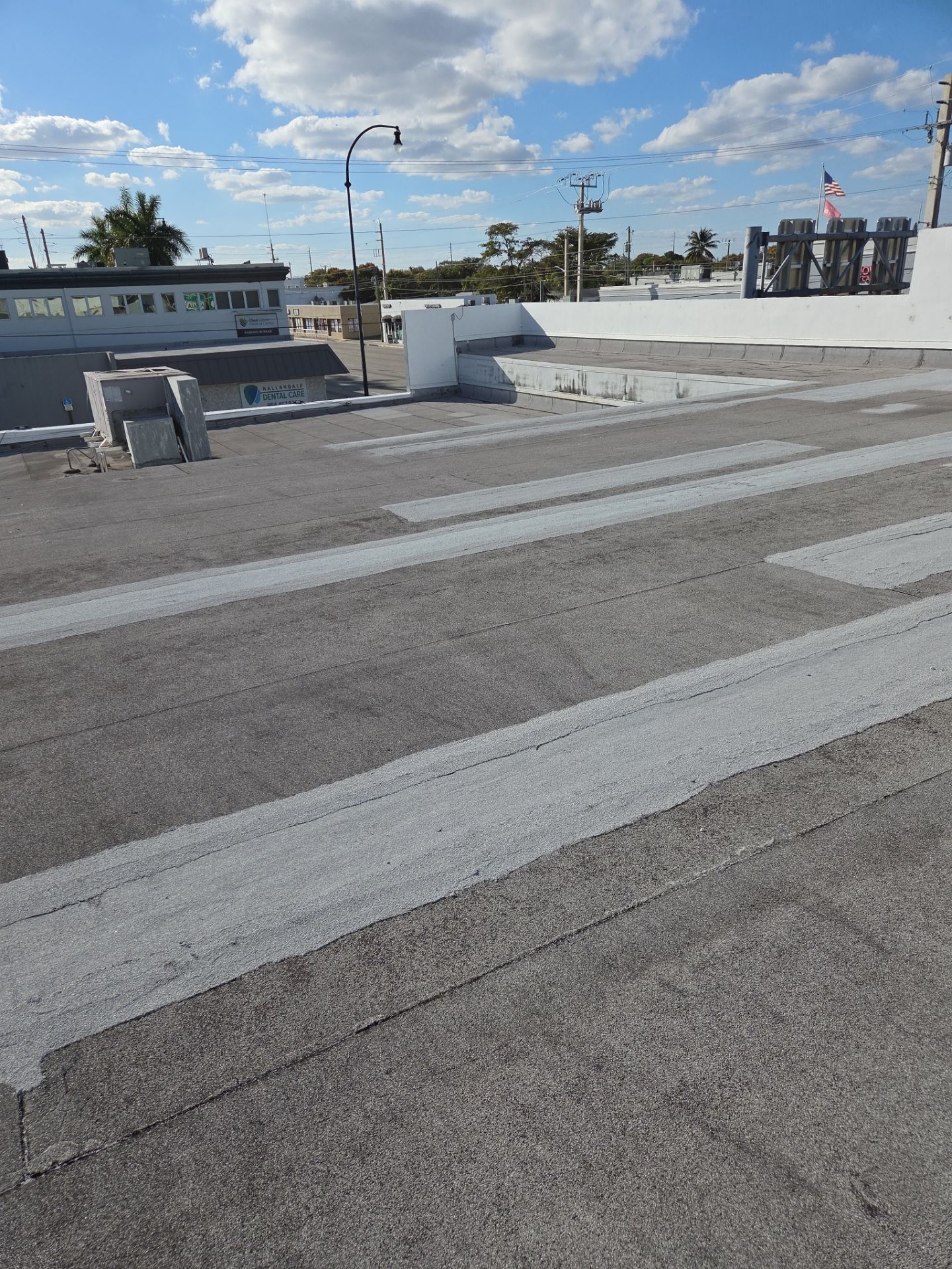 Commercial Flat Roof Restoration Using Silicone Coating in Hallandale Beach by Aastro Roofing