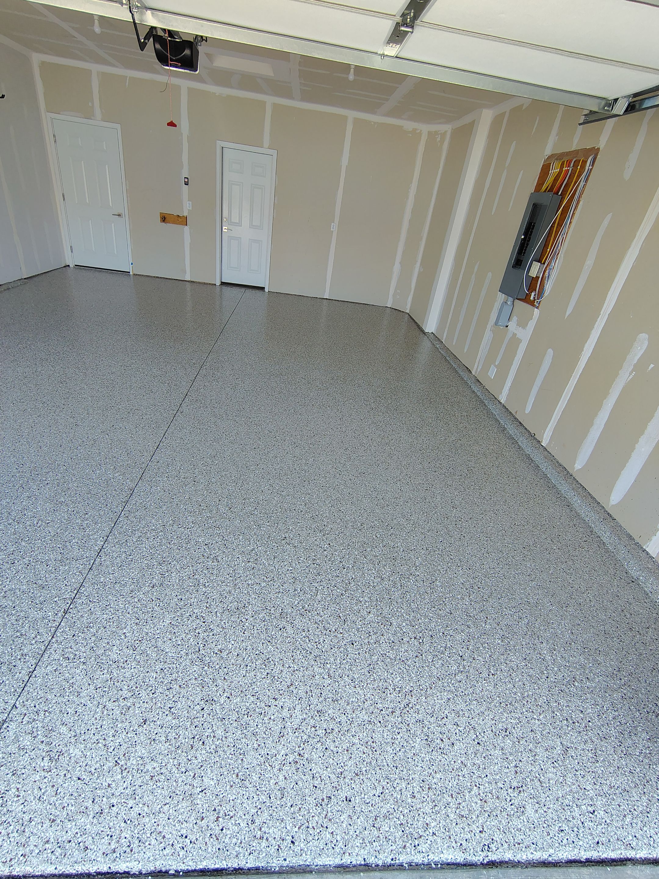 Custom Epoxy Garage Floor and Patio Coating in Sioux Falls by Select Painting, Coatings & Garage Cabinets