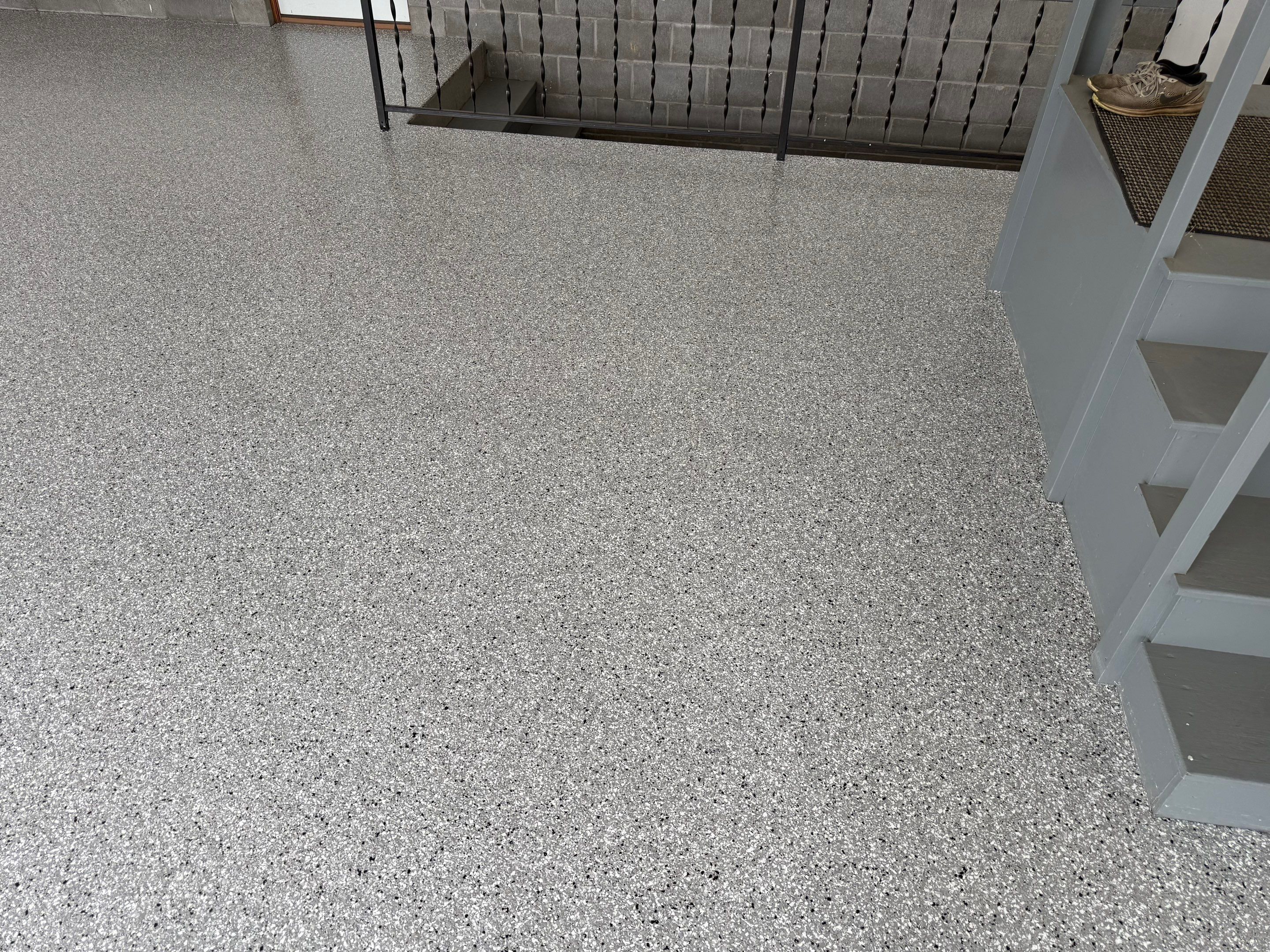 Feather Grey Garage Floor Coating and Concrete Restoration in Mitchell by Select Painting, Coatings & Garage Cabinets