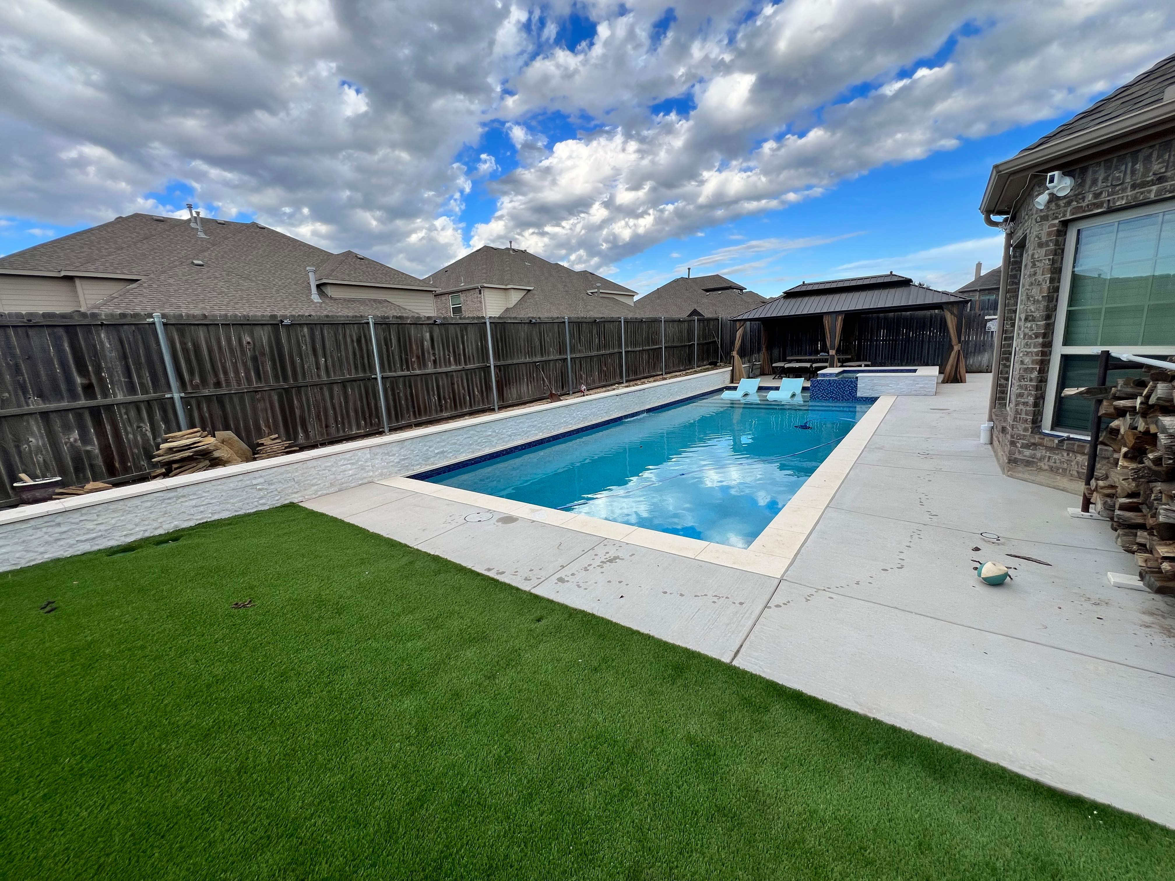 Geometric Pool with Raised Spa and Sun Shelf by Pinnacle Pools and Spas - DFW