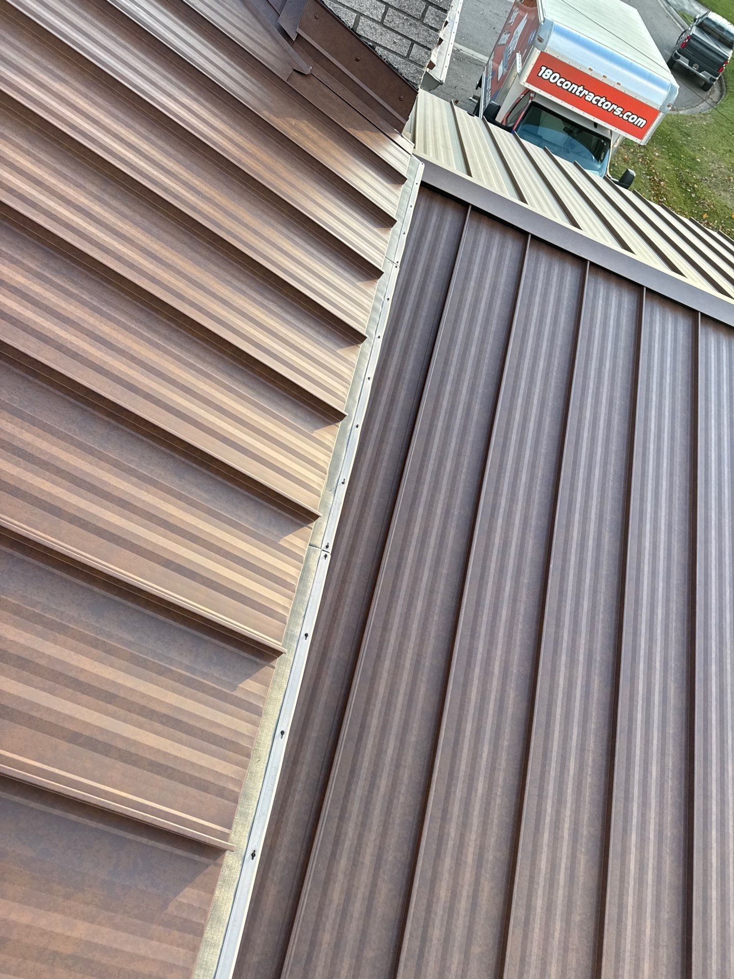 Roof Replacement using MS Standing Seam Roof Western Rust by 180 Contractors