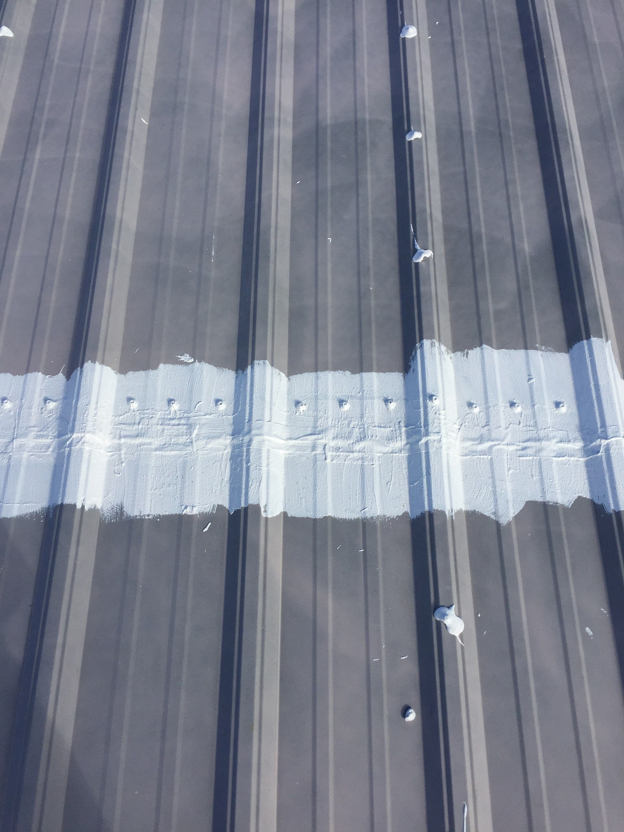 Commercial Roof Coating using Gaco Silicone Roof Coating by Secure Construction Company Inc
