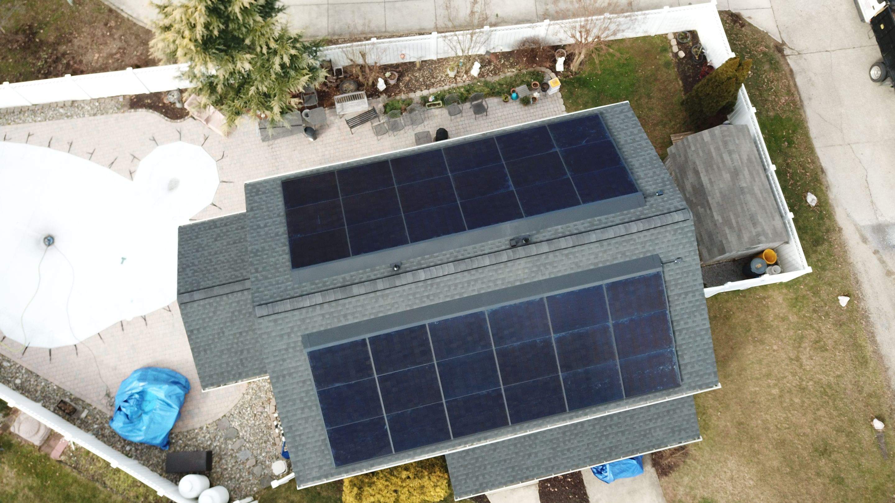 Roof Replacement with GAF Decotech integrated solar panels by American Home Contractors