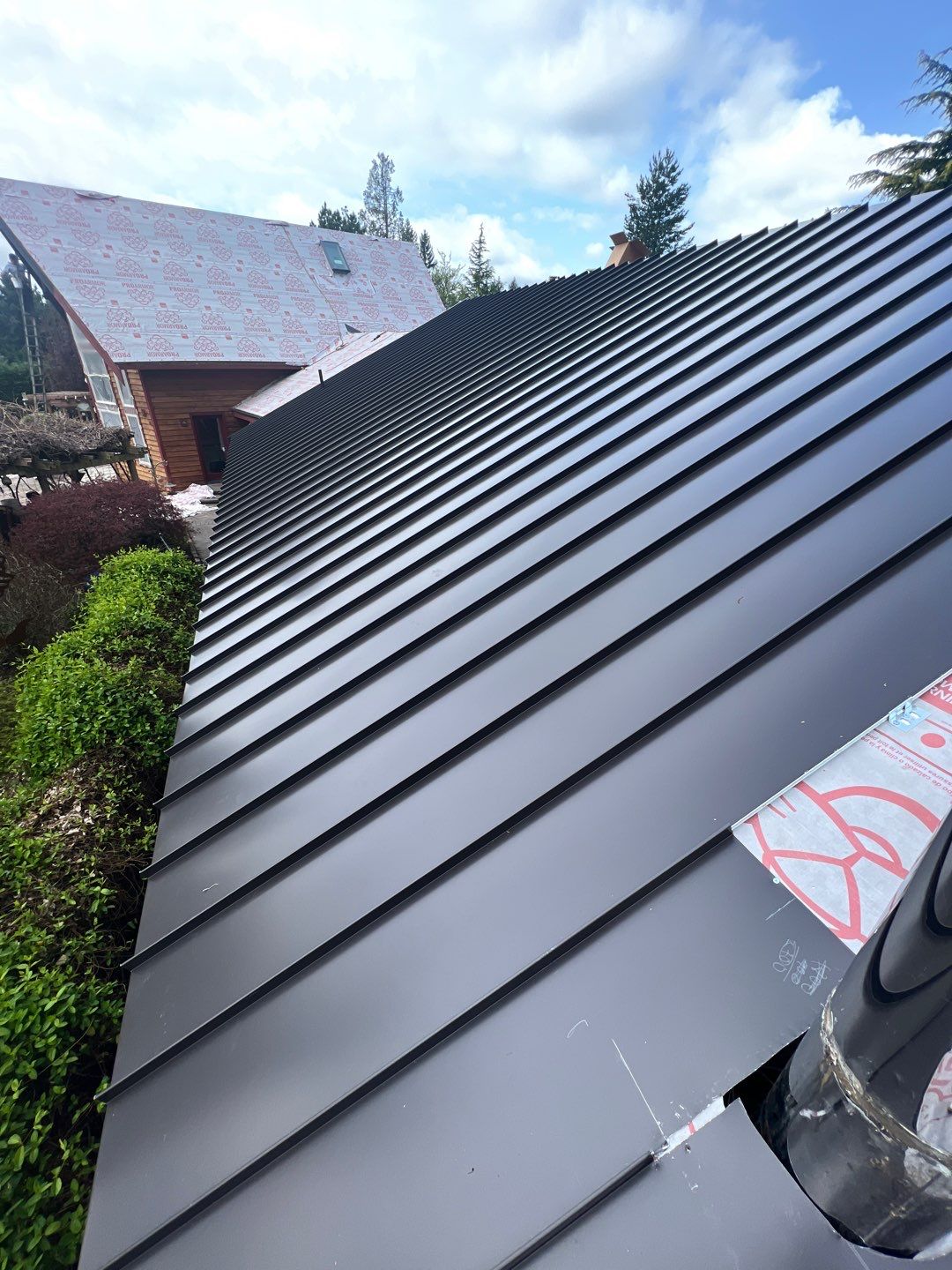 Buckley Roof Replacement using Standing Seam Metal - Dark Bronze by RoofSmart