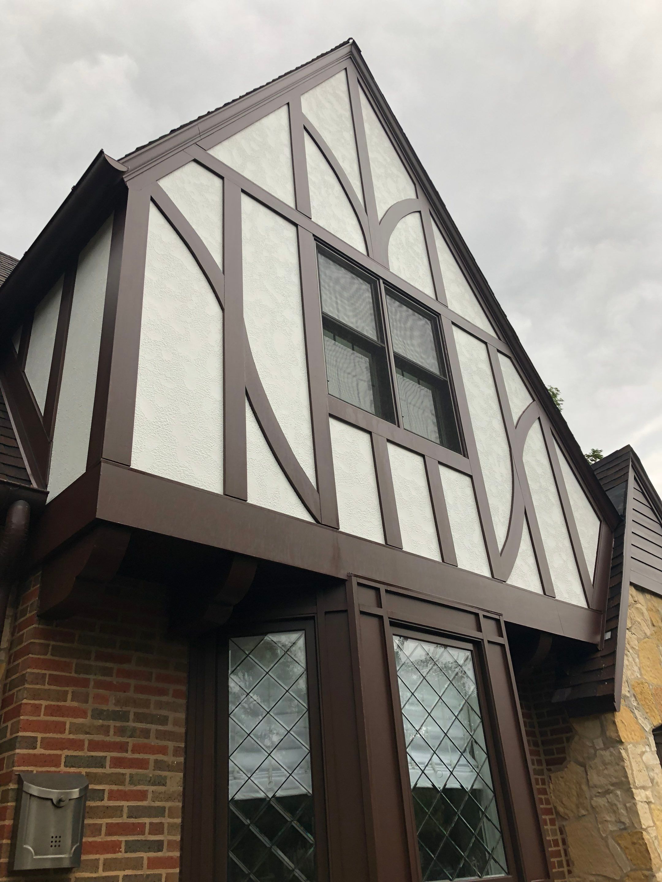 Tudor-Style Hardie Exterior Renovation in Elmhurst by Great American Exteriors