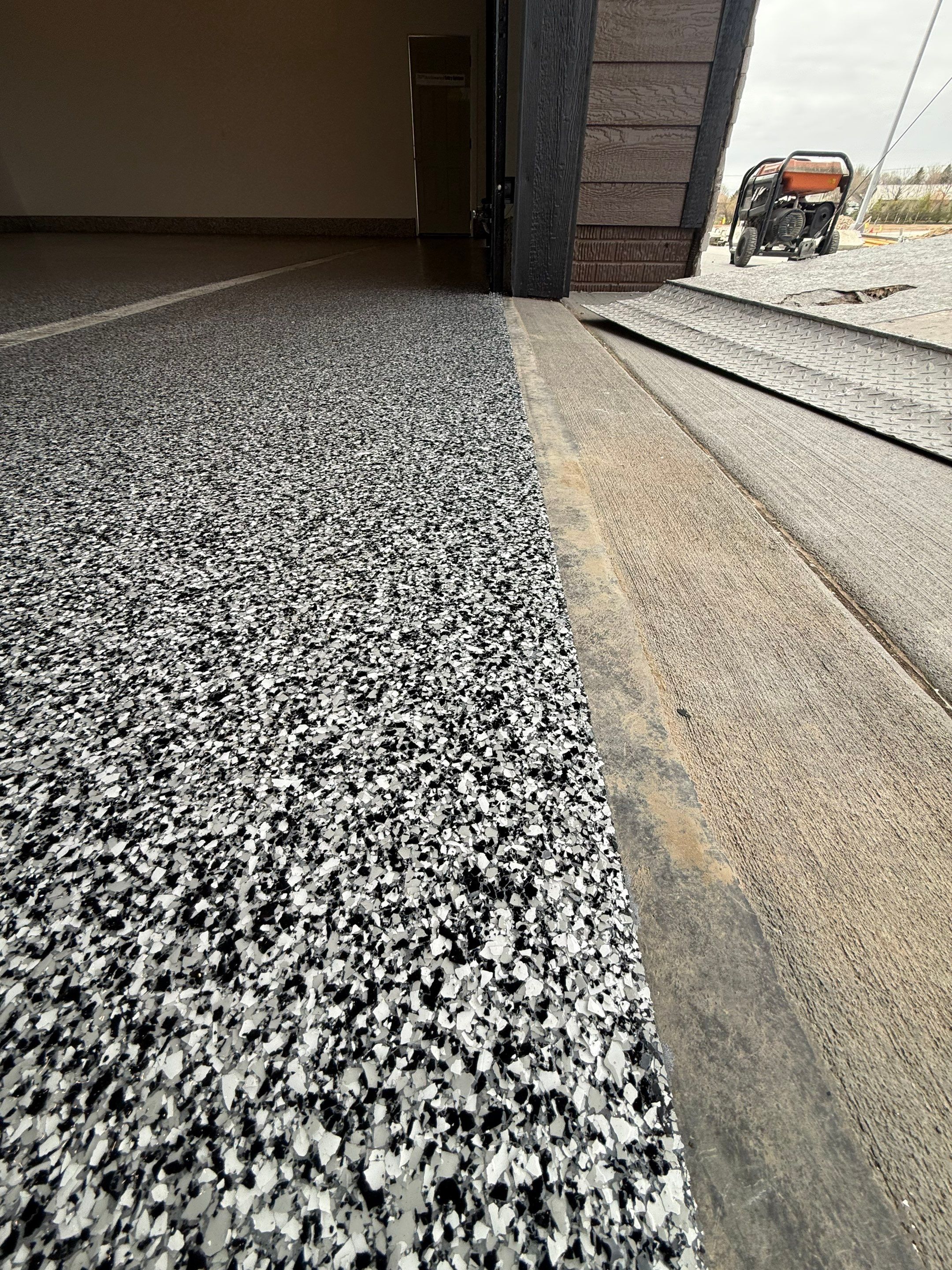 Multi-Car Garage Epoxy Floor Coating and Concrete Finishing in Sioux Falls by Select Painting, Coatings & Garage Cabinets