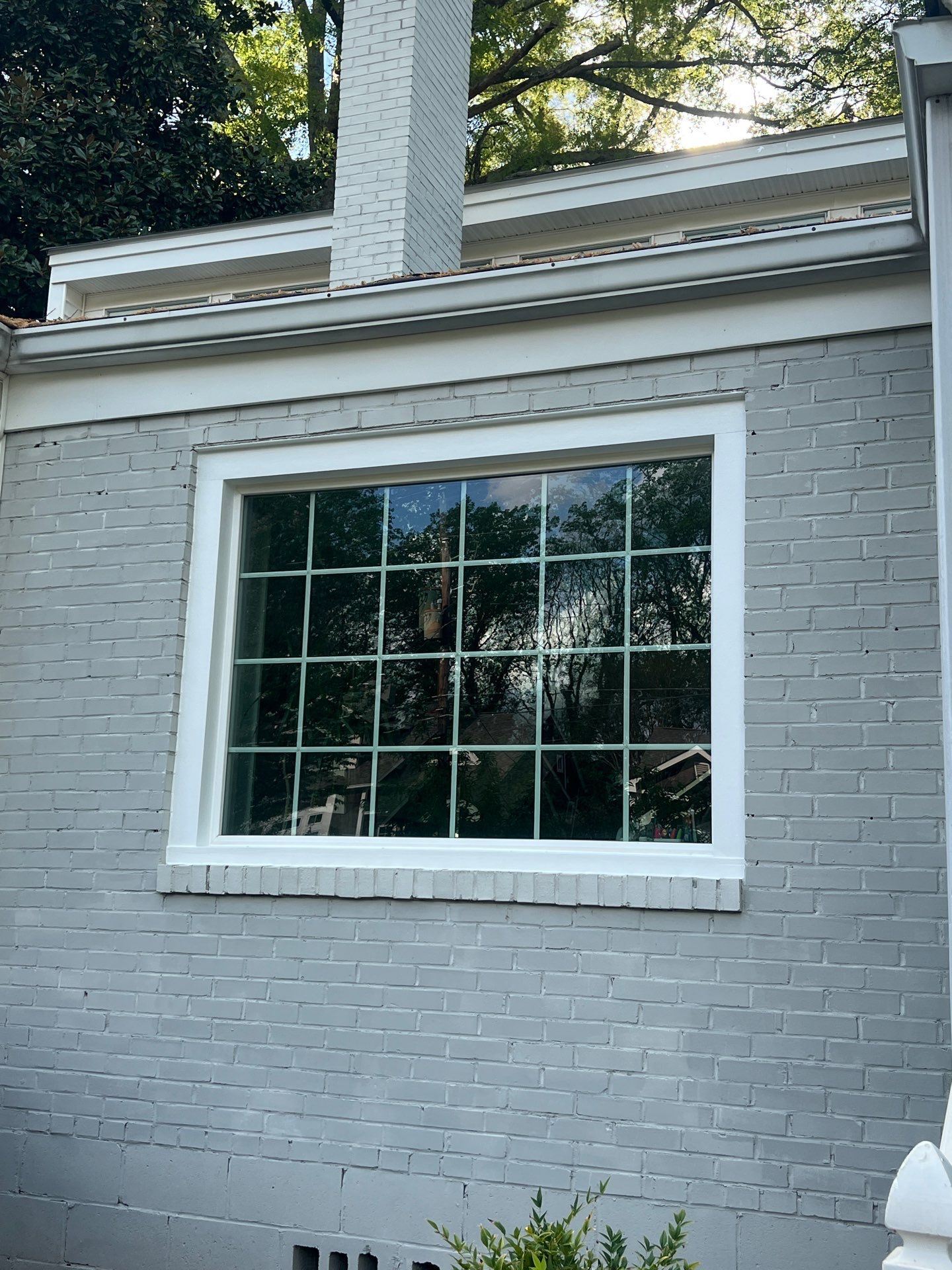 Decatur Exterior Renovation Featuring Painted Brick and Custom Blue Door by Swift Home Renovations