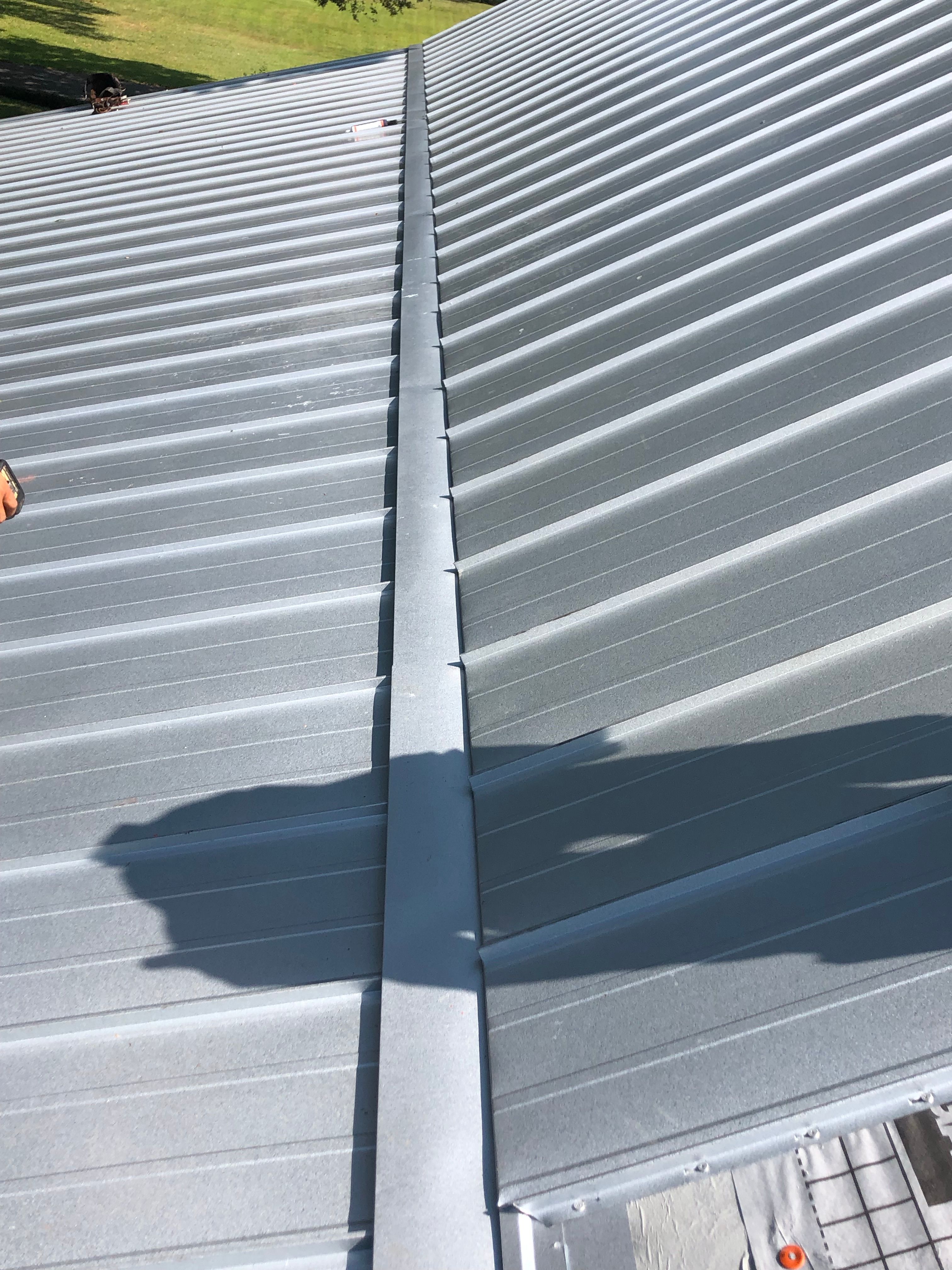 Residential Roofing Installation using Metal roofing by American Roofing & Construction LLC