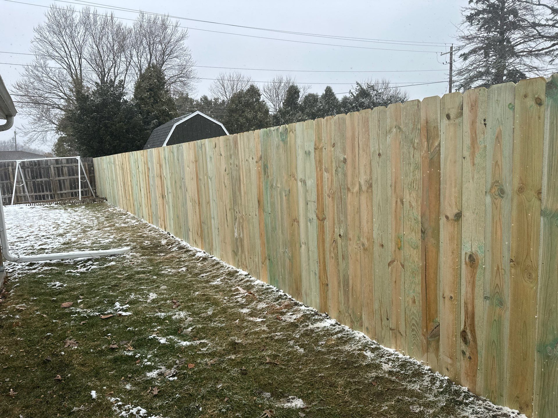 Pressure-Treated Wood Privacy Fence Replacement in Waterloo by Perfect Picket Fence and Stain