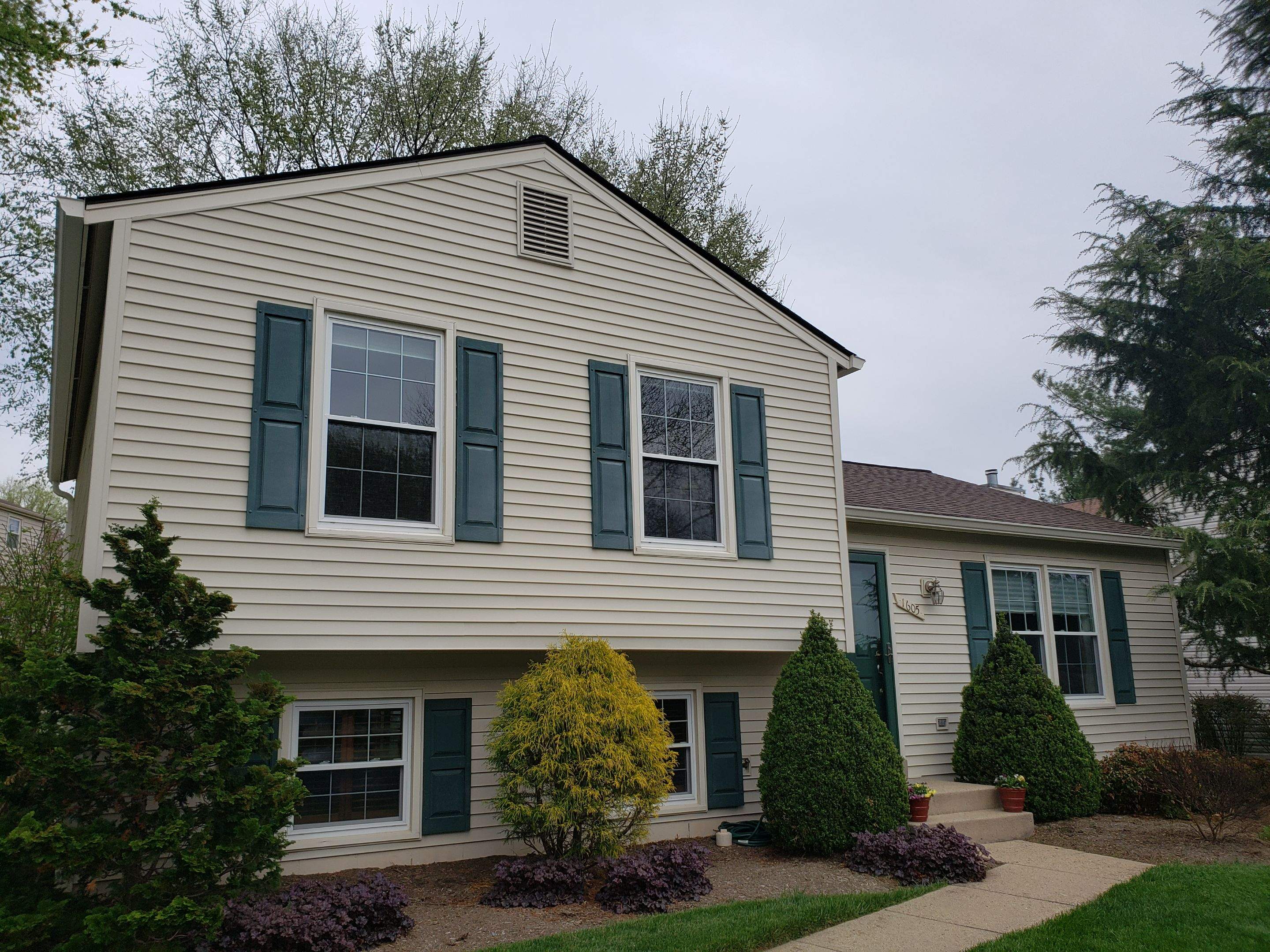New composite windows and fiber cement siding with trim and gutters by Window Depot of Annapolis