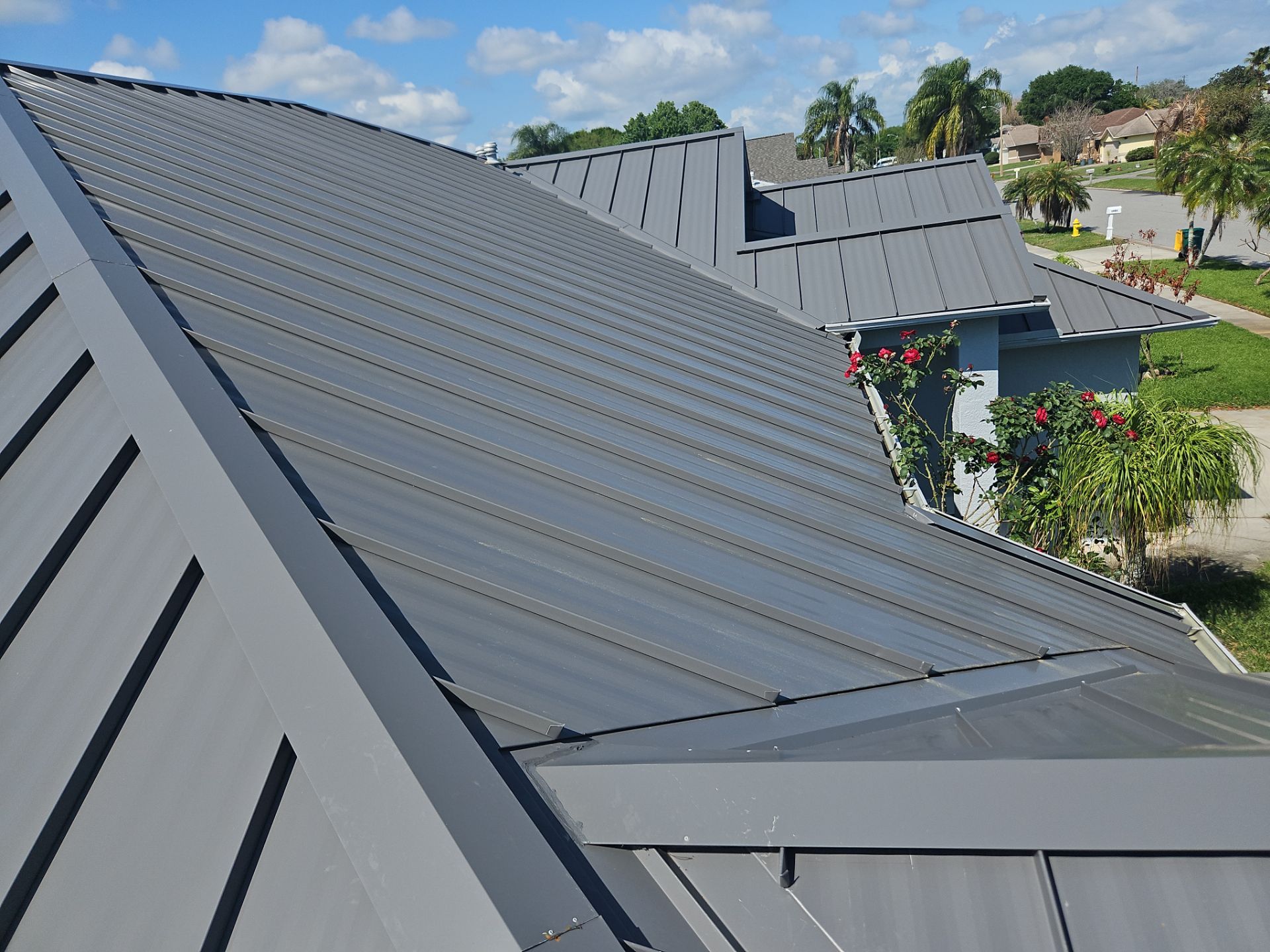 Complete Metal Roof Replacement and Seamless Gutter Installation in Melbourne by Wiedmann Construction & Roofing