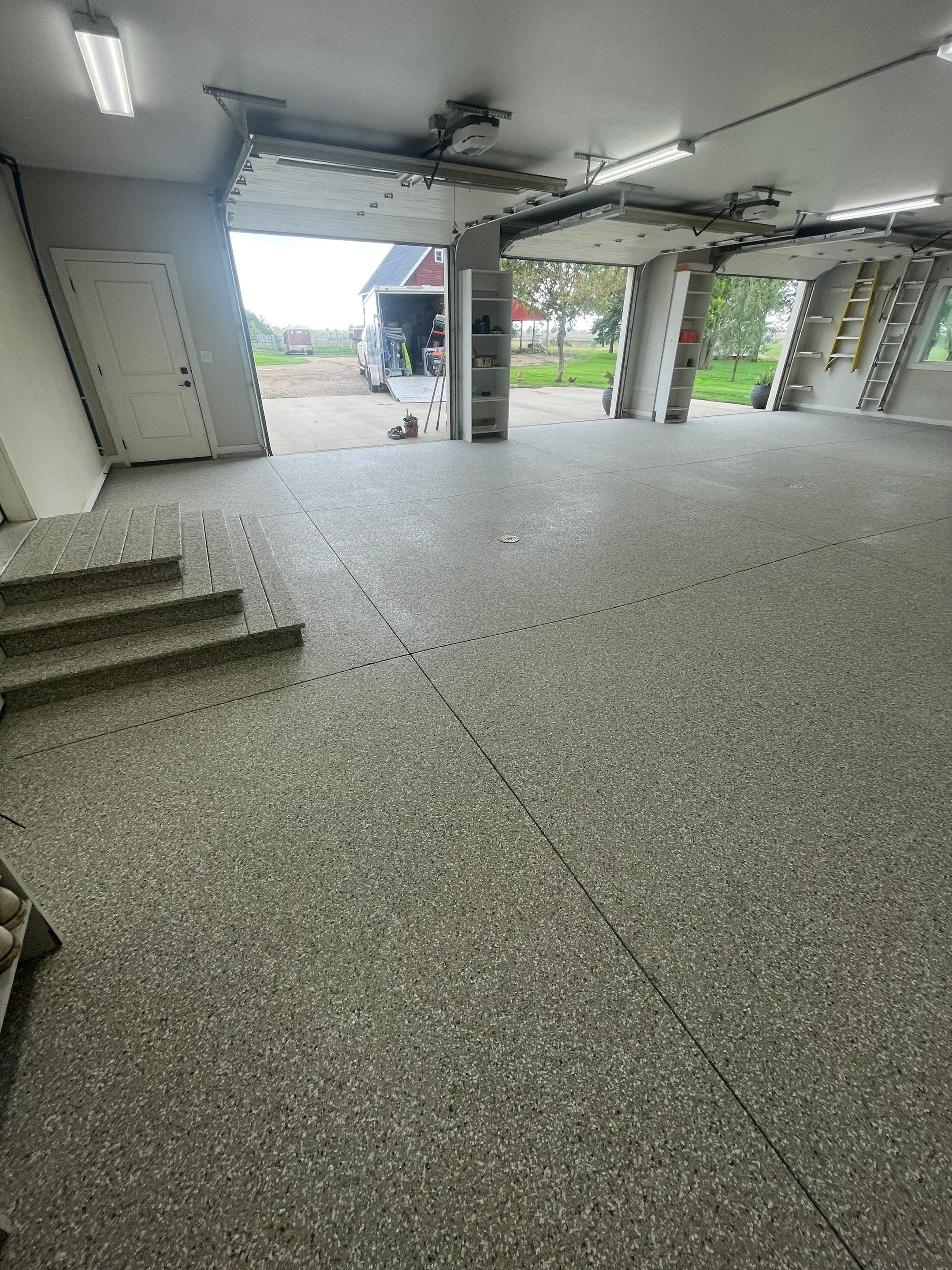 Grey Speckled Polyuera Garage Floor Coating for Hartford Three-Car Garage by Select Painting, Coatings & Garage Cabinets