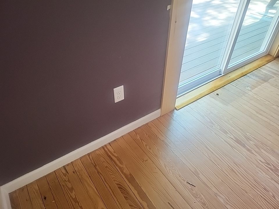 Deck installation using cable railing. by Burke Home Services