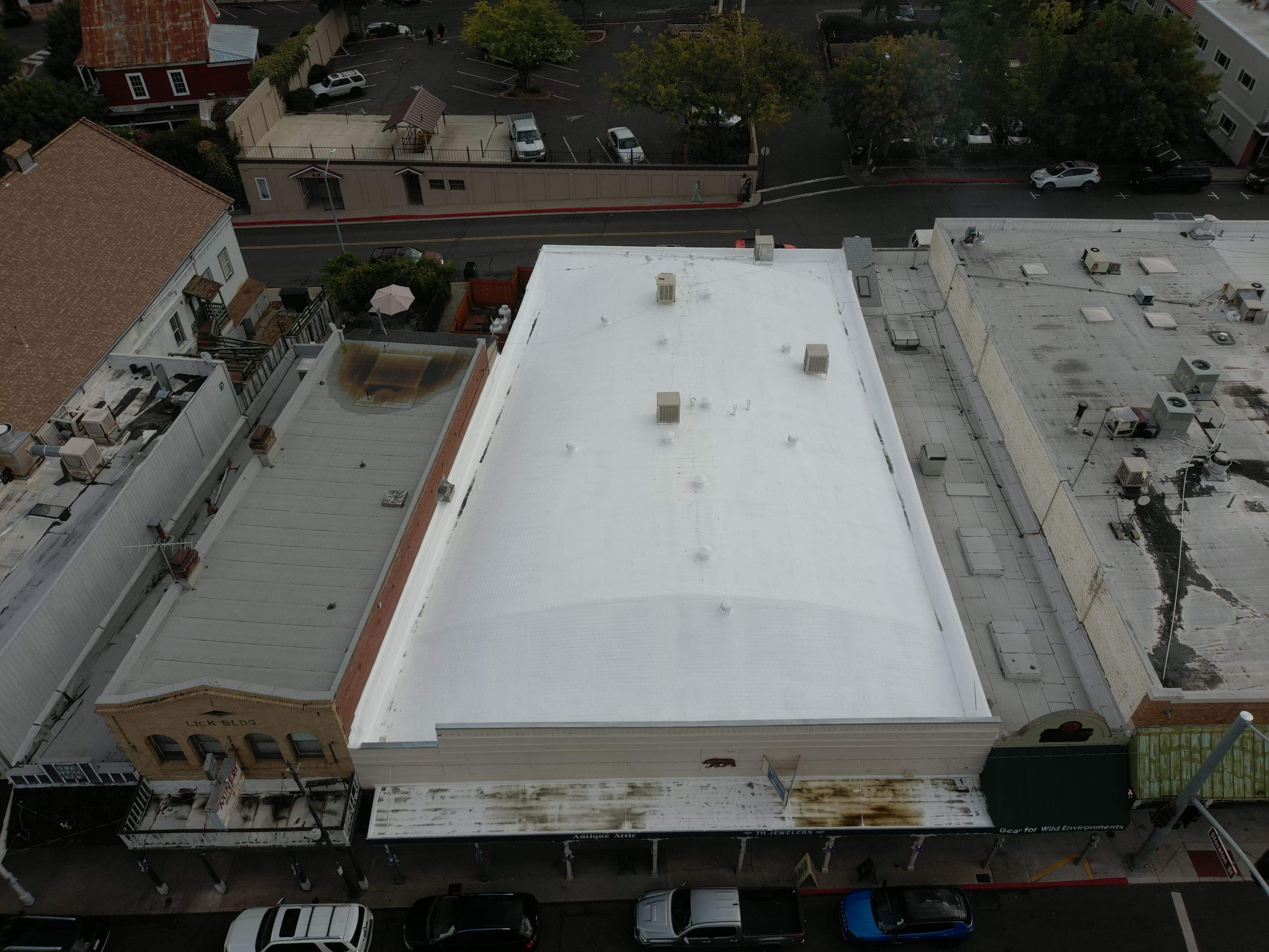 Foam and coatings on commercial roof by Straight Edge Roofing Inc