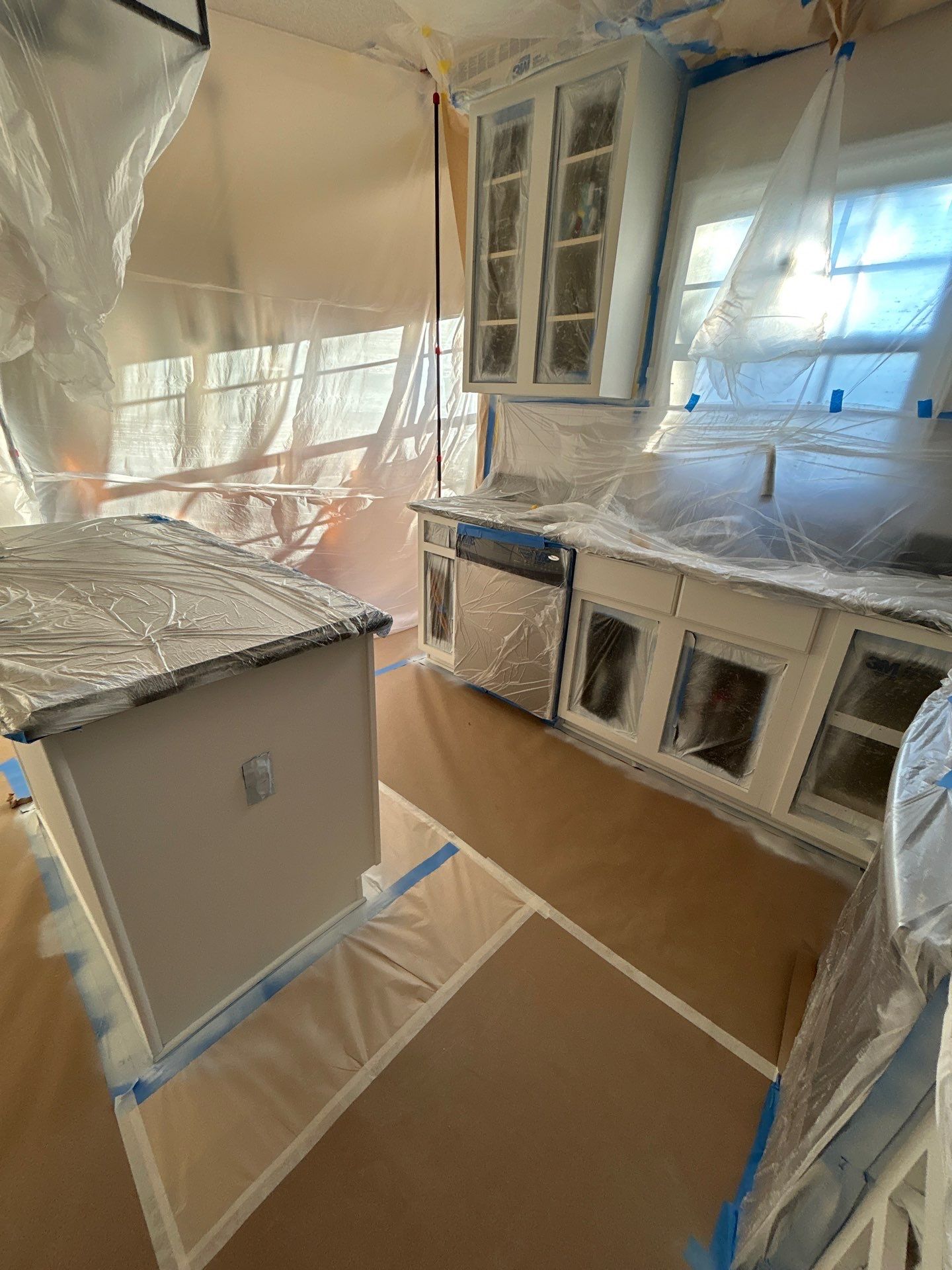 Cabinet painting by GonzalezPainters & Contractors Inc 