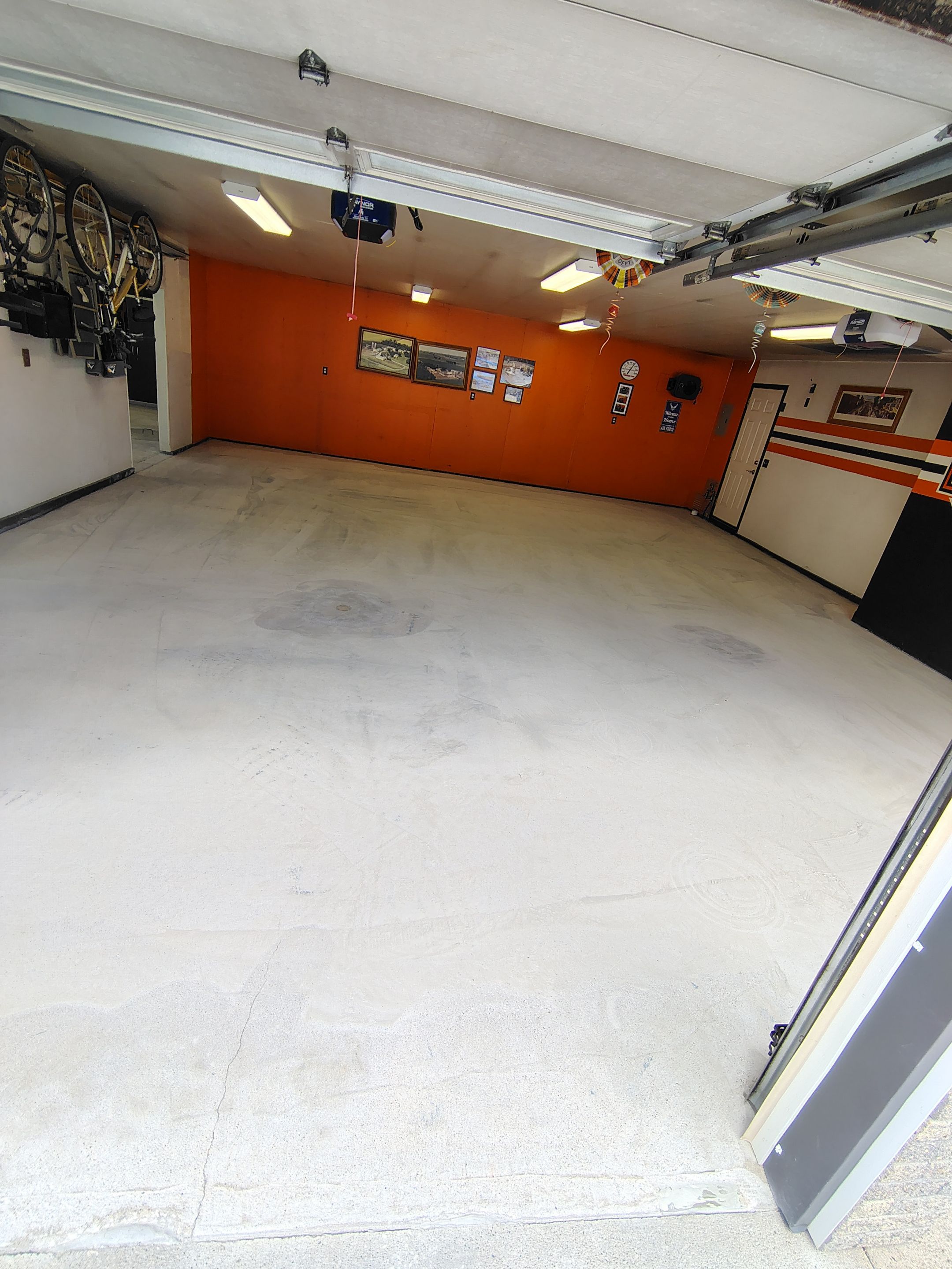 Custom Grey Flake Epoxy Garage Floor Installation in Remsen by Select Painting, Coatings & Garage Cabinets