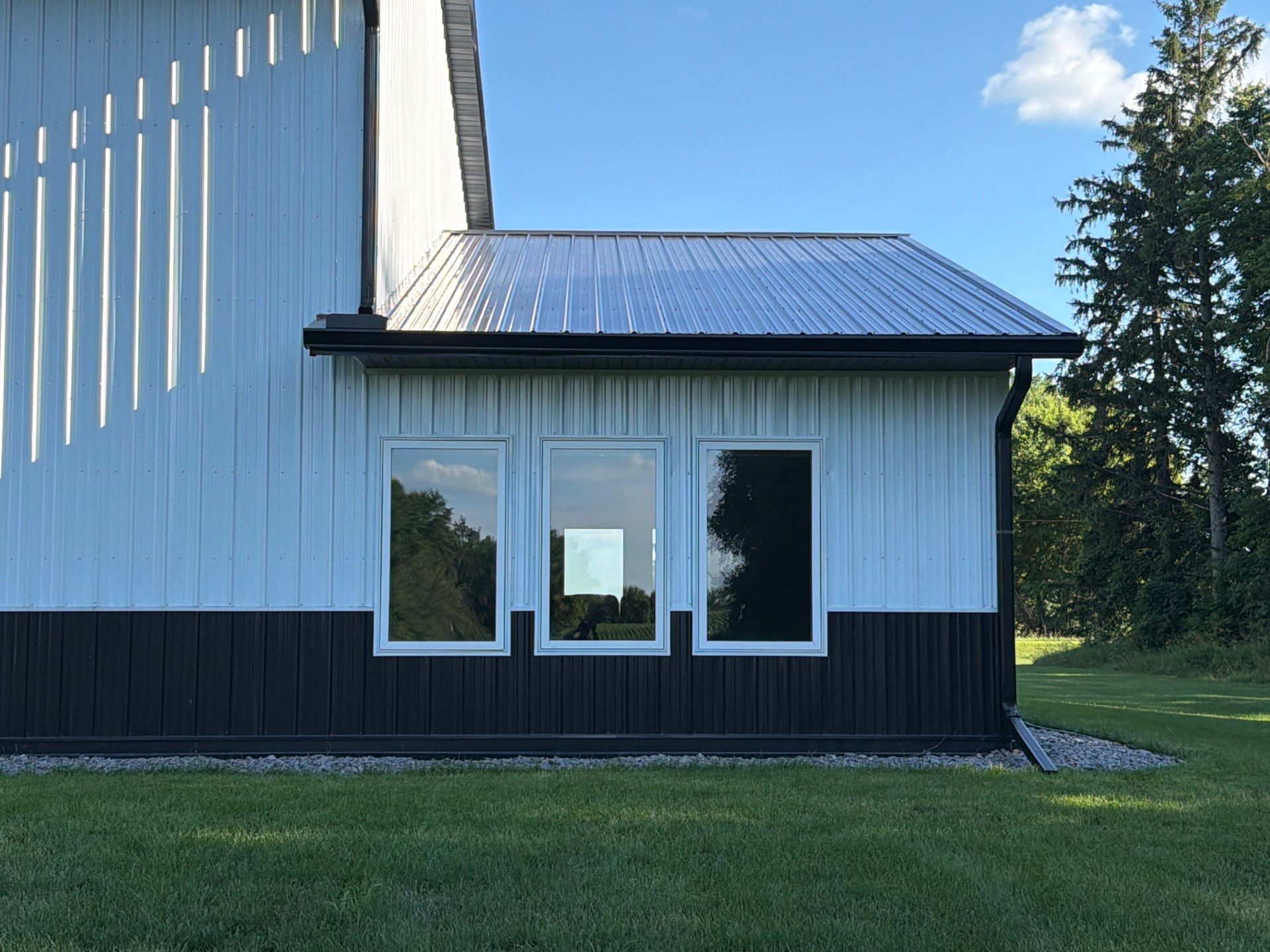 Black Seamless Gutter Installation for barndominium in Buffalo by Next Level Seamless Gutters / Exteriors Inc.